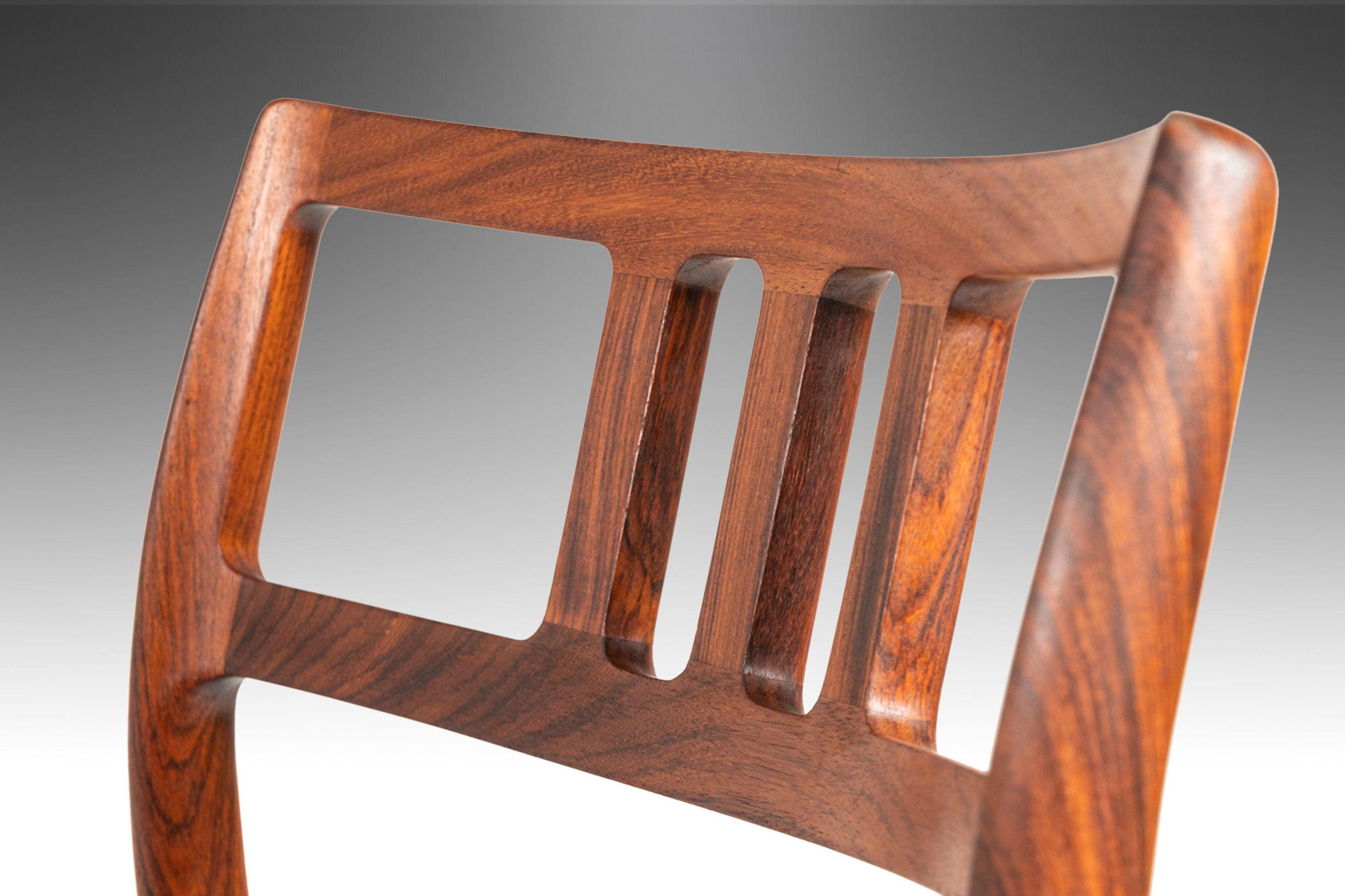 As comfortable as it is visually stunning this exquisite model # 79, designed by the iconic Niels Otto Møller, is the epitome of functional art. Constructed of solid Brazilian Rosewood with exceptional old-growth woodgrains and forged into an