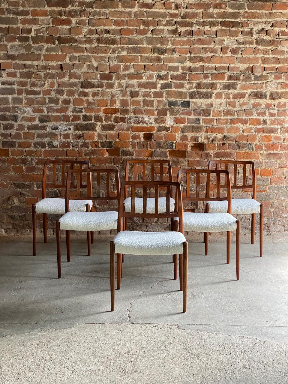 Moller model 83 rosewood dining chairs set of six in Bouclé Denmark 1970

??magnificent set of Niels Otto Møller model 83 rosewood dining chairs manufactured by J.L. Møllers Møbelfabrik Denmark, circa 1970, the set of six solid Rosewood frames