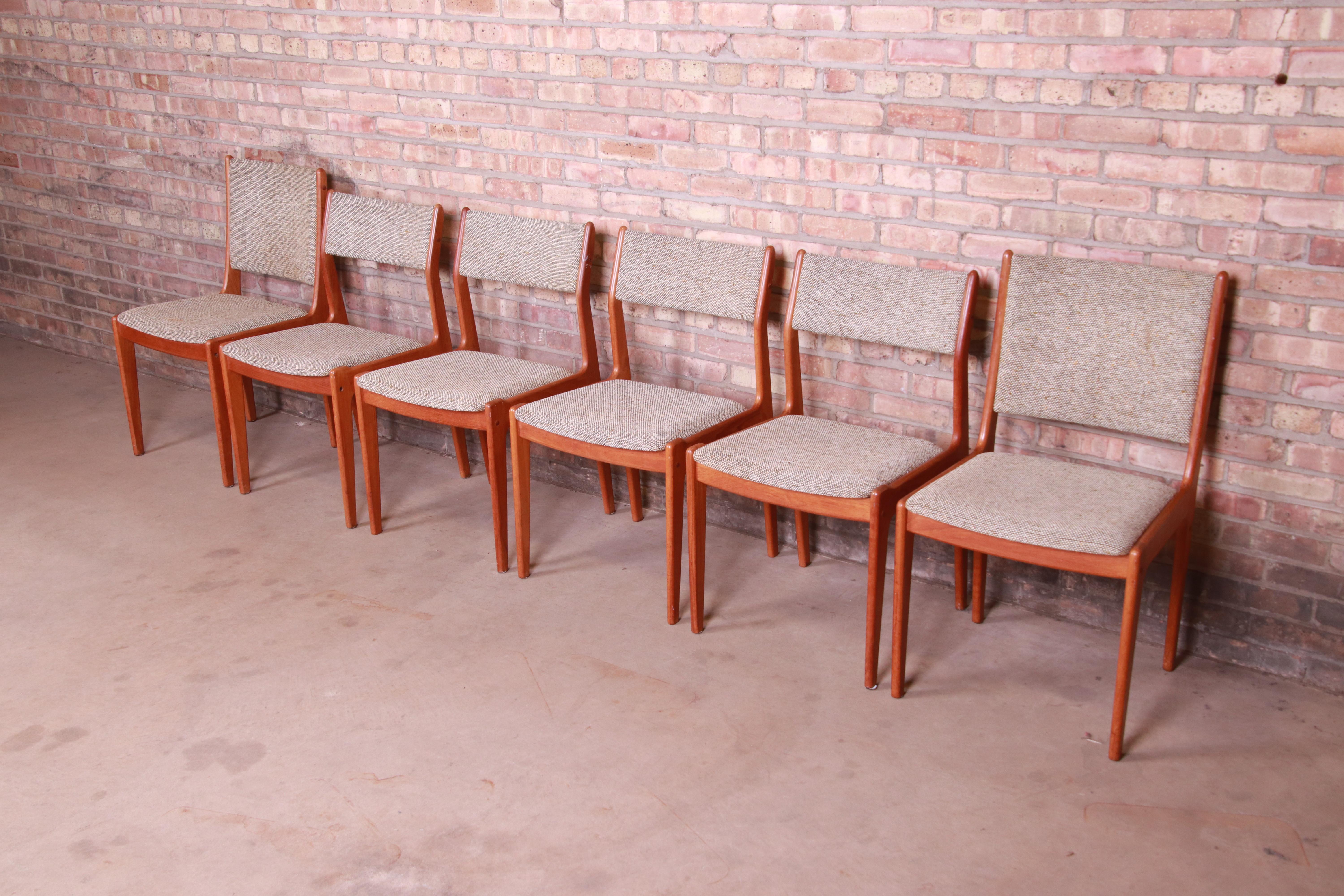 A gorgeous set of six mid-century Danish modern style dining chairs

In the manner of J.L. Moller

By Scandinavia Woodworks Co.

Singapore, Mid-20th Century

Sculpted teakwood frames, with upholstered seats and backs.

Measures:
Captain
