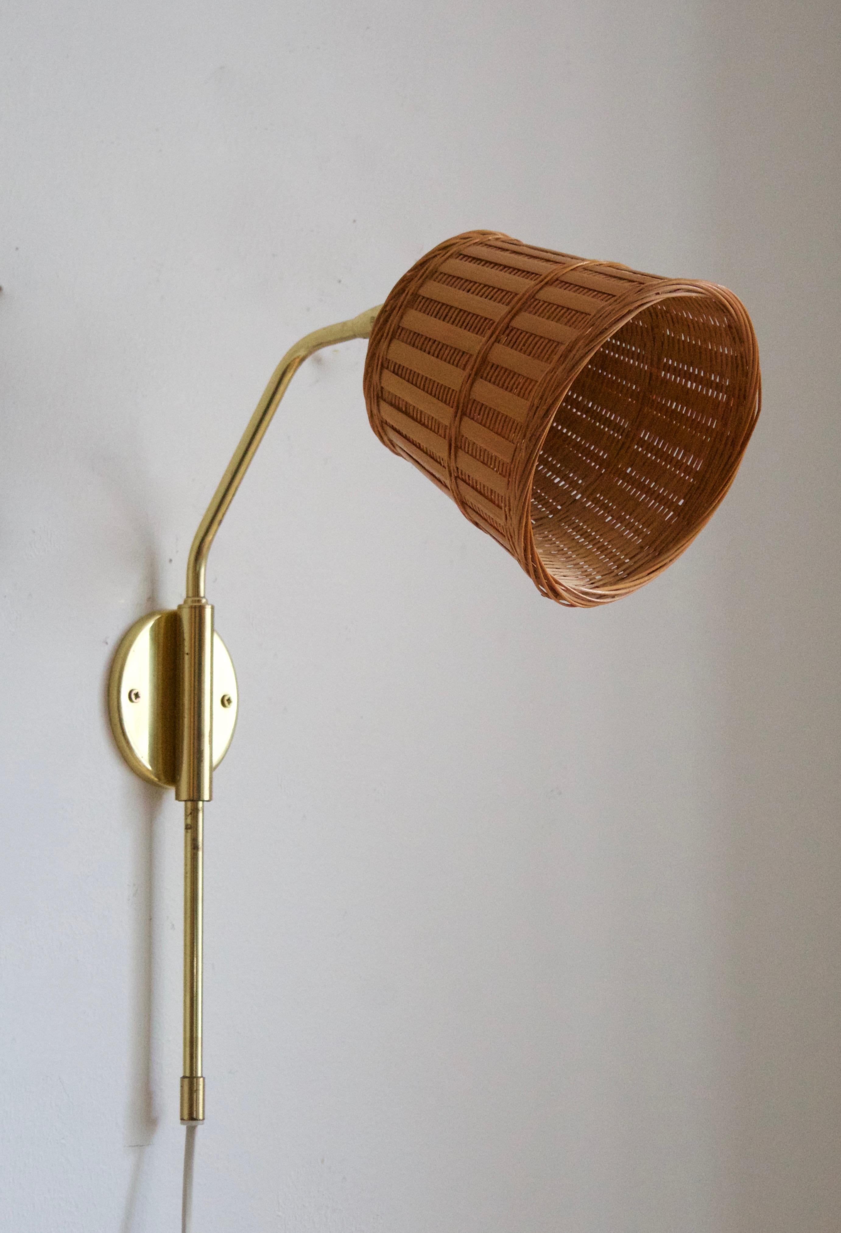 A pair of table lamps. Designed and produced by Möllers Armatur Elektriska, Eskilstuna, Sweden, c. 1960s. Marked. Assorted rattan lampshade.

Stated dimensions including lampshades.

 