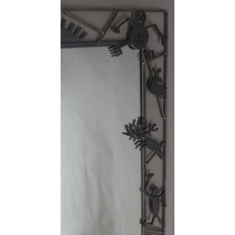 Mollie Massie iron frame mirror. Custom design iron mirror frame. Artist Mollie Massie describes her art, 