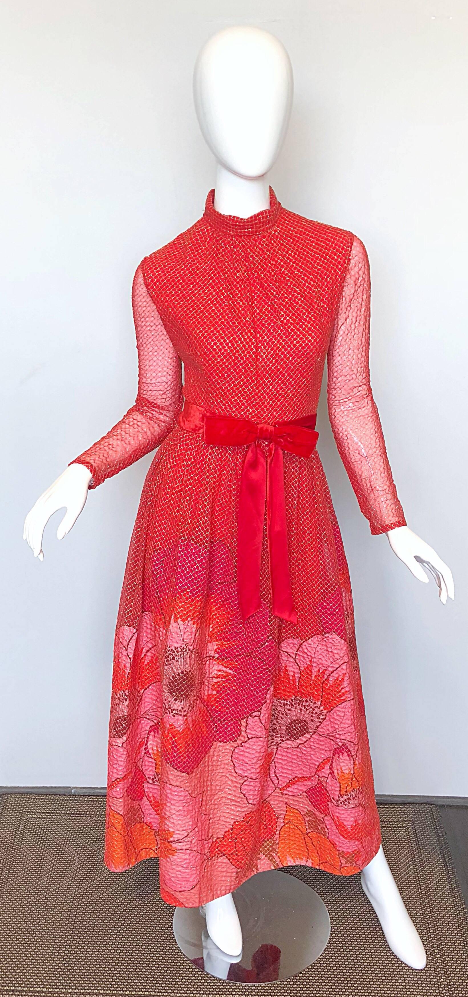 Gorgeous vintage 1970s MOLLIE PARNIS red, pink and gold gown / maxi dress! Tailored high neck bodice with a forgiving and flattering full skirt that features a red velvet bow belt. Long semi sheer sleeves with hidden snaps at each cuff. Pink and red