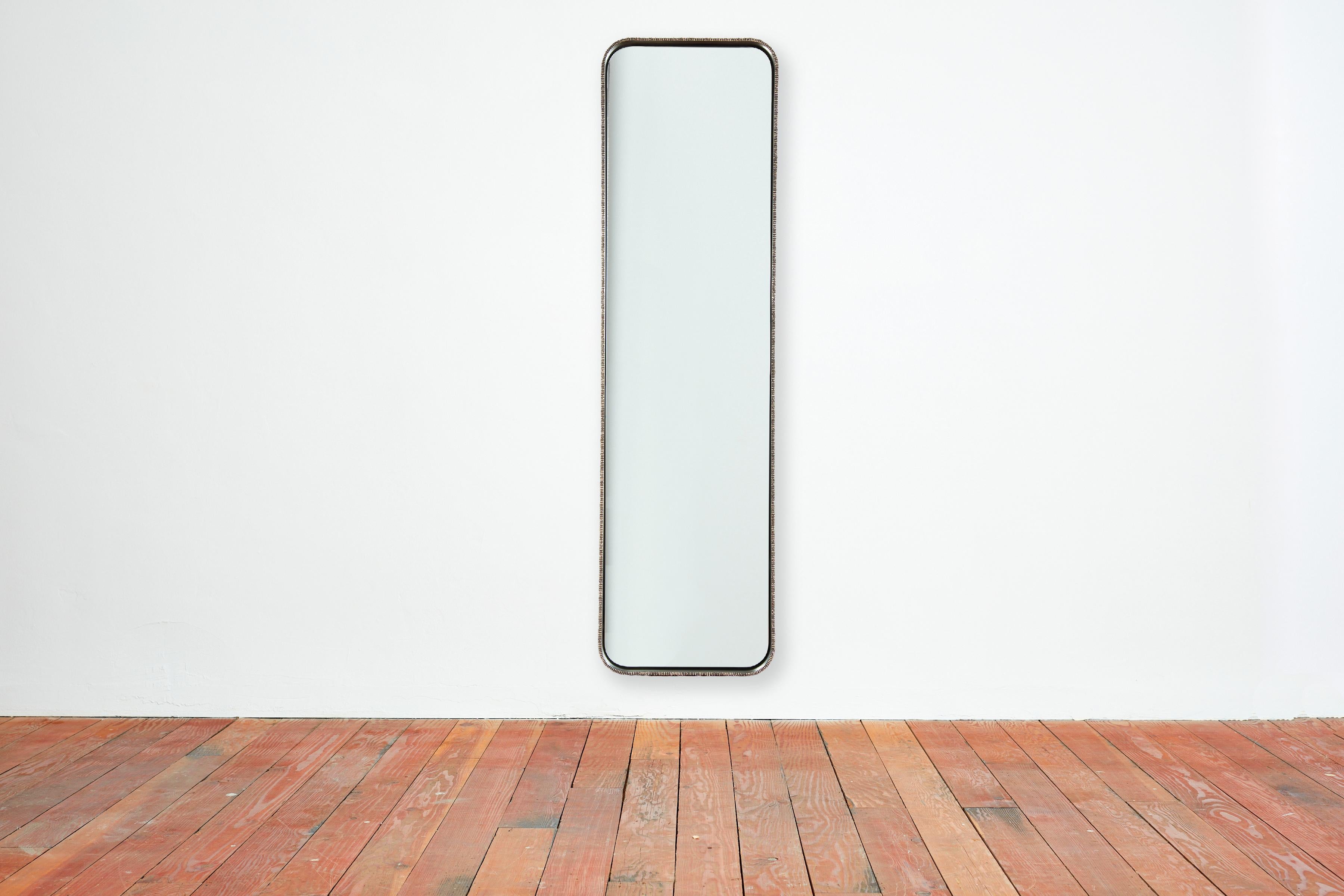 Molten Elongated Mirror by William Emmerson
Dimensions: D 7,6 x W 55,9 x H 203,2 cm.
Materials: Bronze and steel.
 
A mesmerizing luxury mirror that melds steel, bronze and a molten finish. William Emmerson's brilliantly designed 