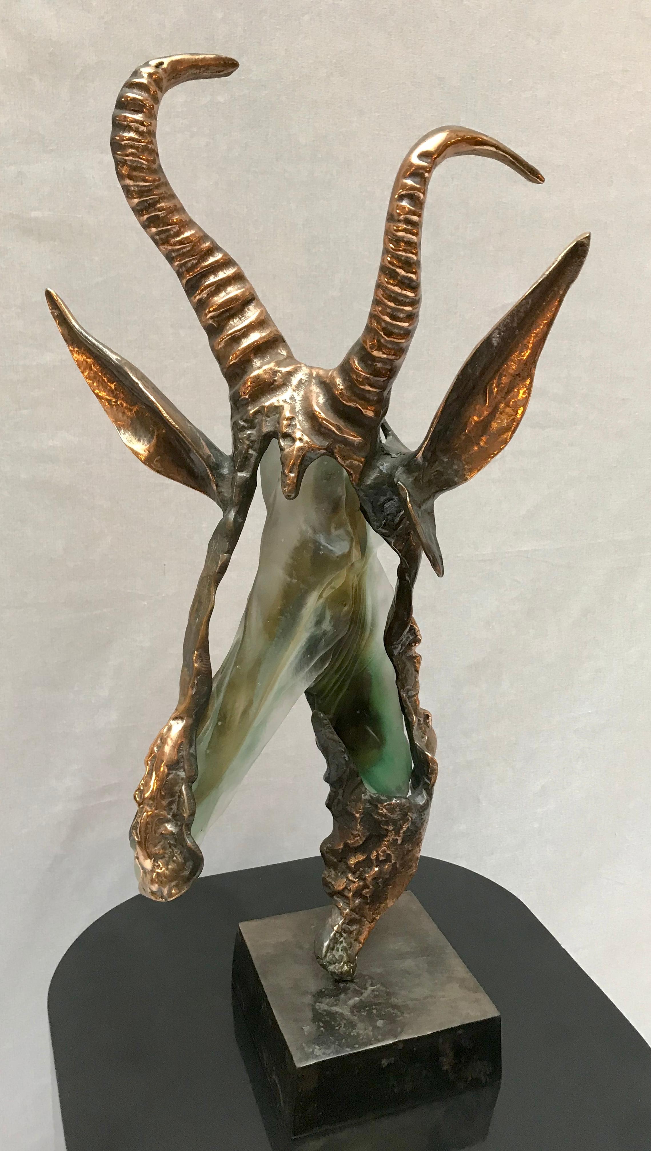 A molten glass and bronze figurative sculpture, Mid-Century Modern, with a bronze base.