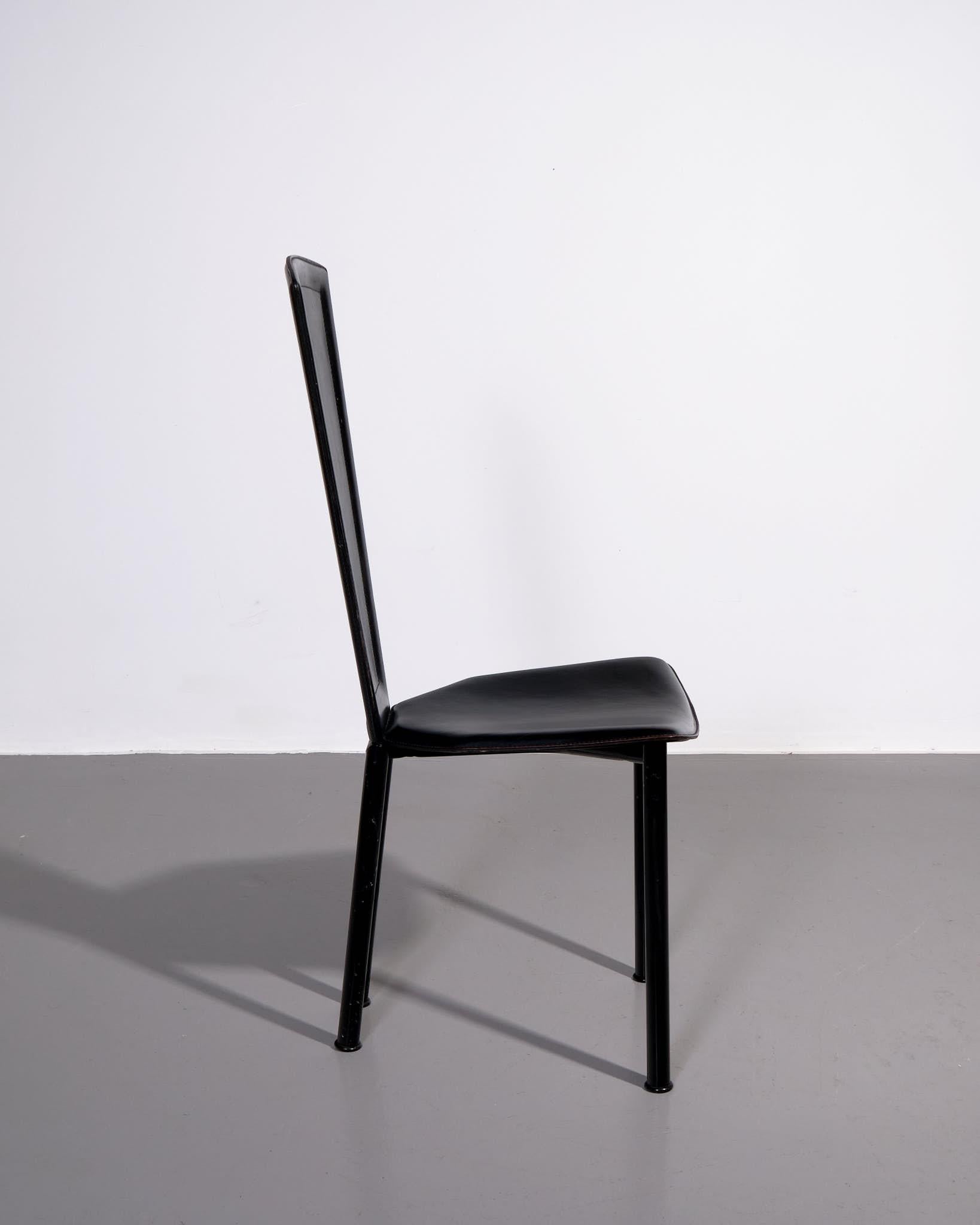 A sleek and sophisticated set of four dining chairs by Molteni & Consonni, crafted in Italy circa 1980s. Upholstered entirely in smooth black leather, these chairs reflect the refined minimalism and quality craftsmanship associated with late