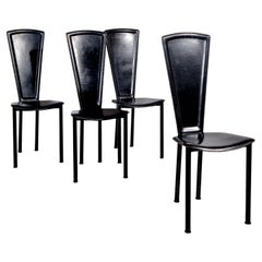 Molteni y Consonni Juego de cuatro sillas de comedor de cuero negro años 80