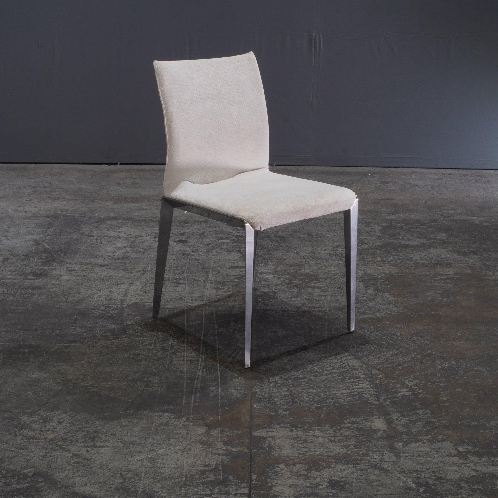 The Molteni & C Dart Chair offers both comfort and style. Designed by the renowned Molteni & C, this chair features a modern design and high-quality materials. Its  ergonomic shape ensures comfort, while its sleek appearance enhances any dining