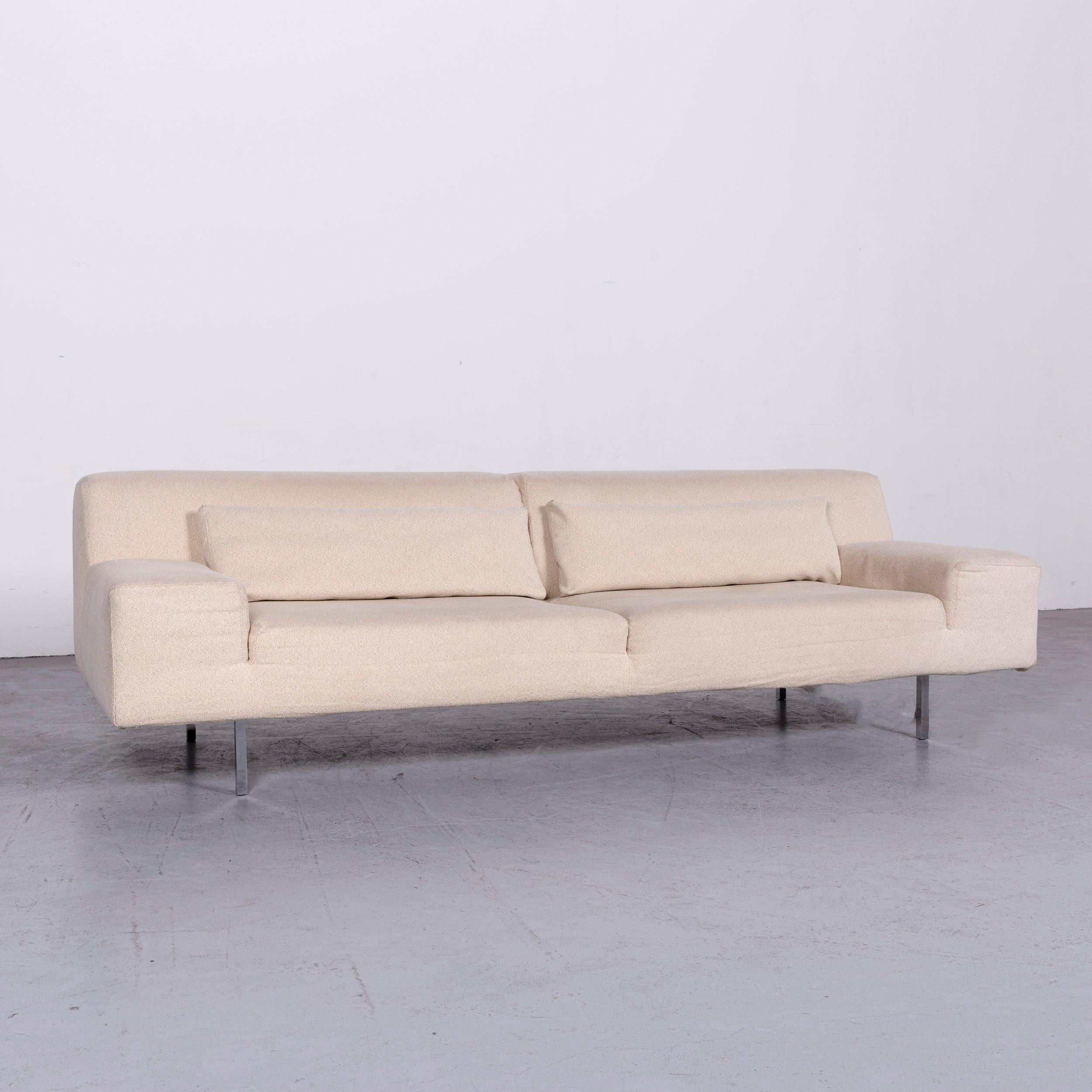 We bring to you a Molteni designer fabric sofa creme three-seat couch.