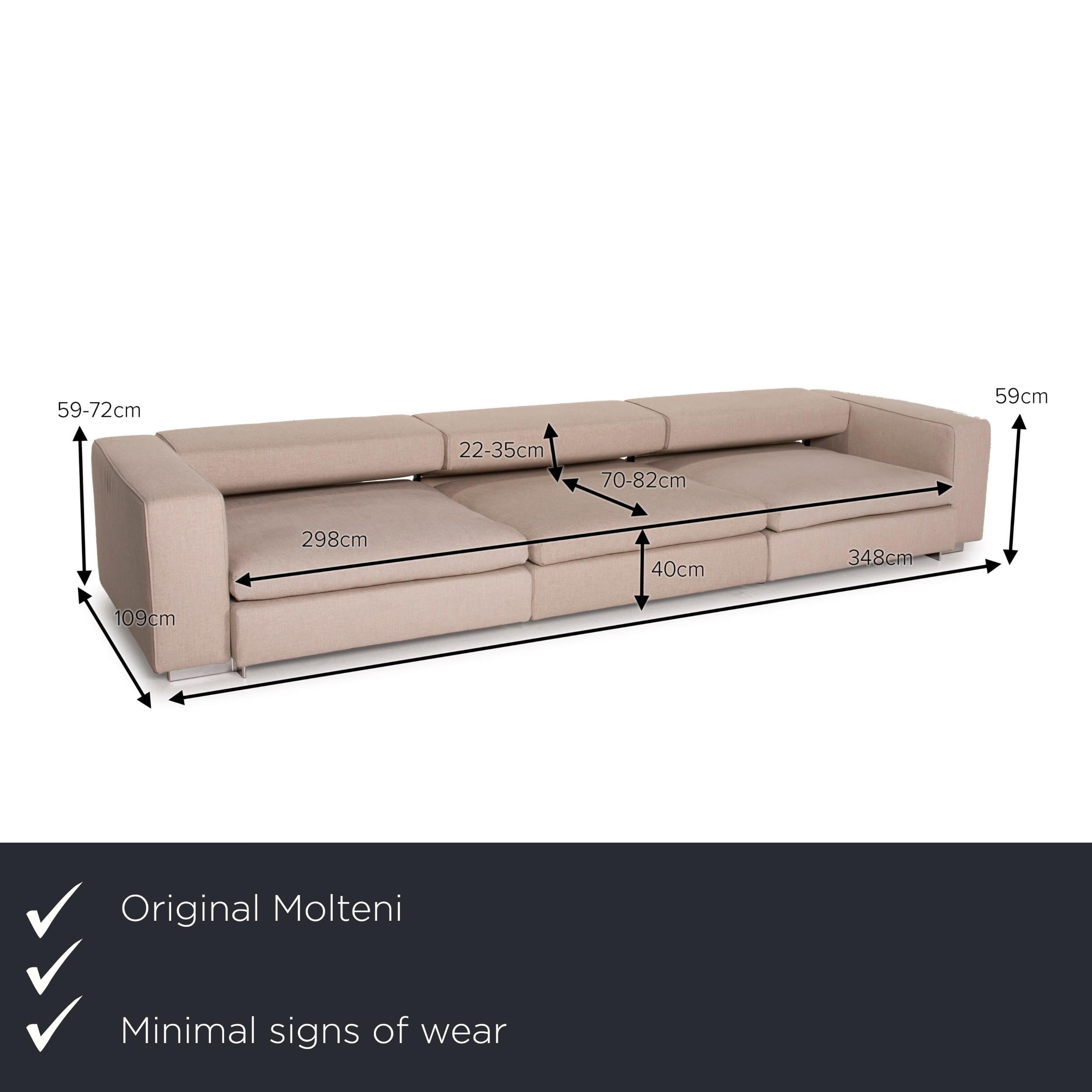 We present to you a Molteni Turner fabric sofa beige three-seater function.

Product measurements in centimeters:

Depth 109
Width 348
Height 59
Seat height 40
Rest height 59
Seat depth 70
Seat width 298
Back height 22.
 
 
   