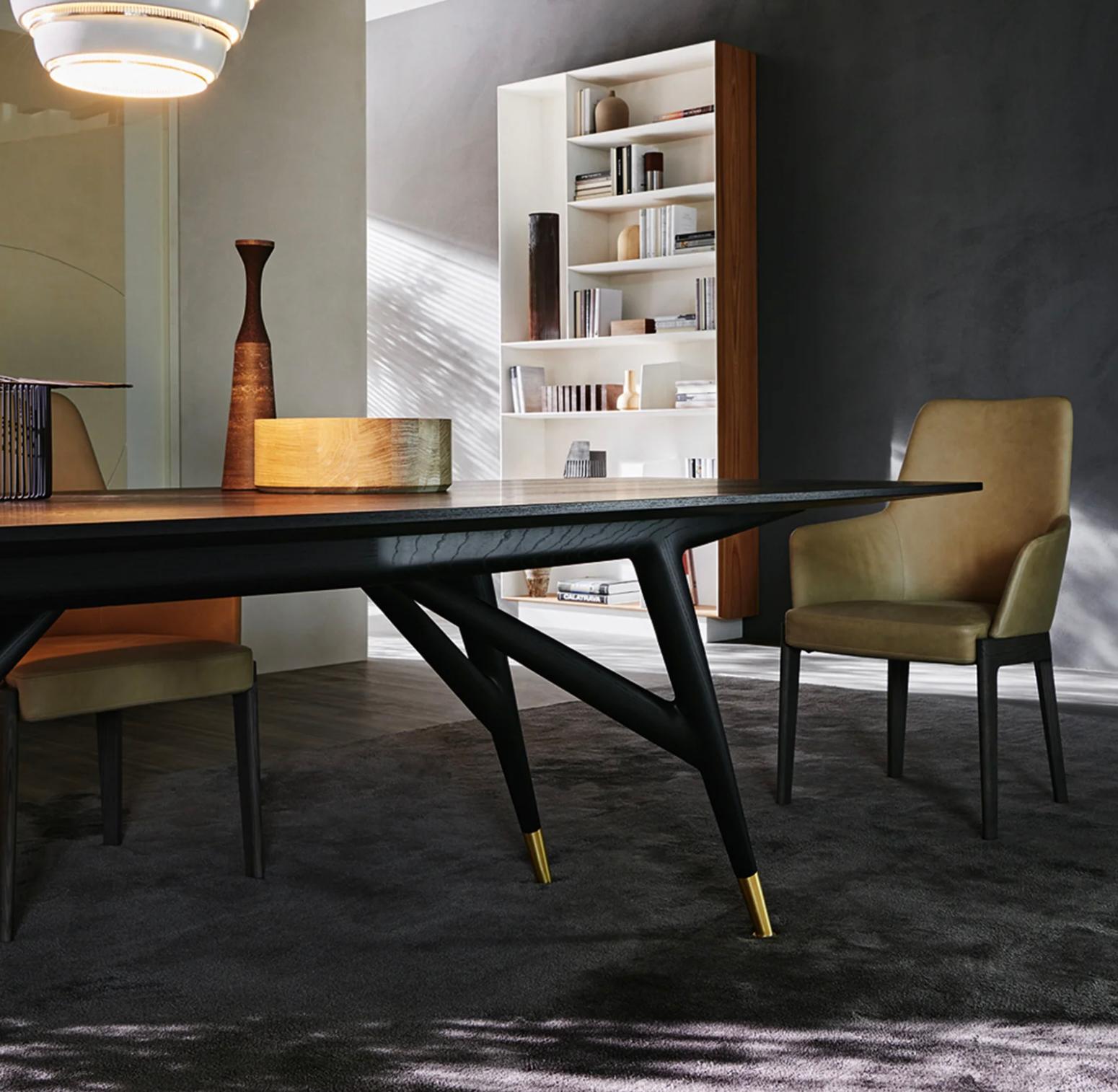 Gio Ponti's stunning conference table completely transforms the concept of meeting spaces through its simple and sleek design. An impressive 2.8 meters long, it retains a minimalist profile with two rounded edges and two flat edges. The generous