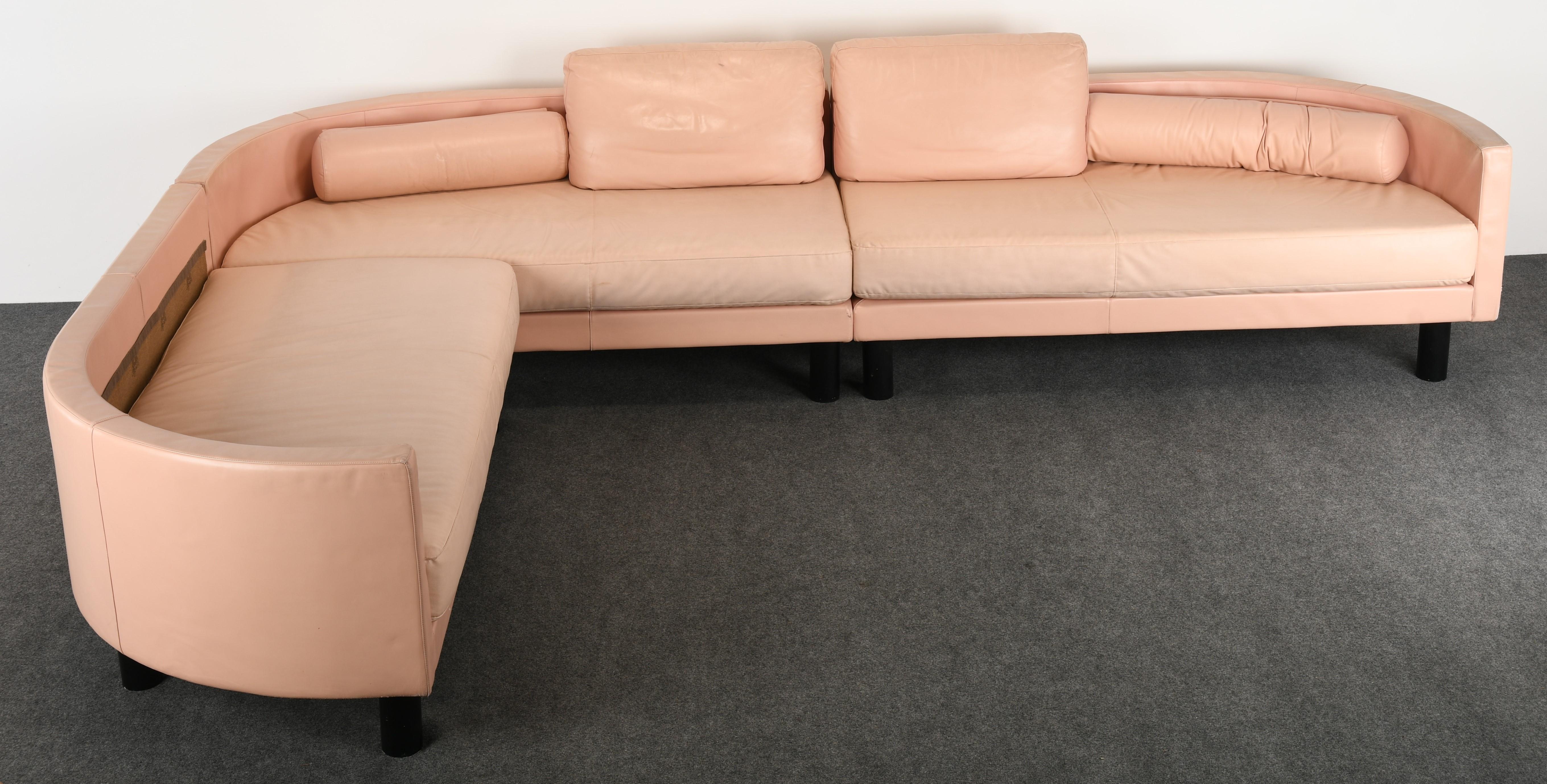 A very unique sectional sofa by Antonietta Ammannati and Giampiero Vitelli. The architect and designers created this innovative design sofa in 1988. The elegant sofa is missing some pillows but the structure is there to reupholster in your favorite