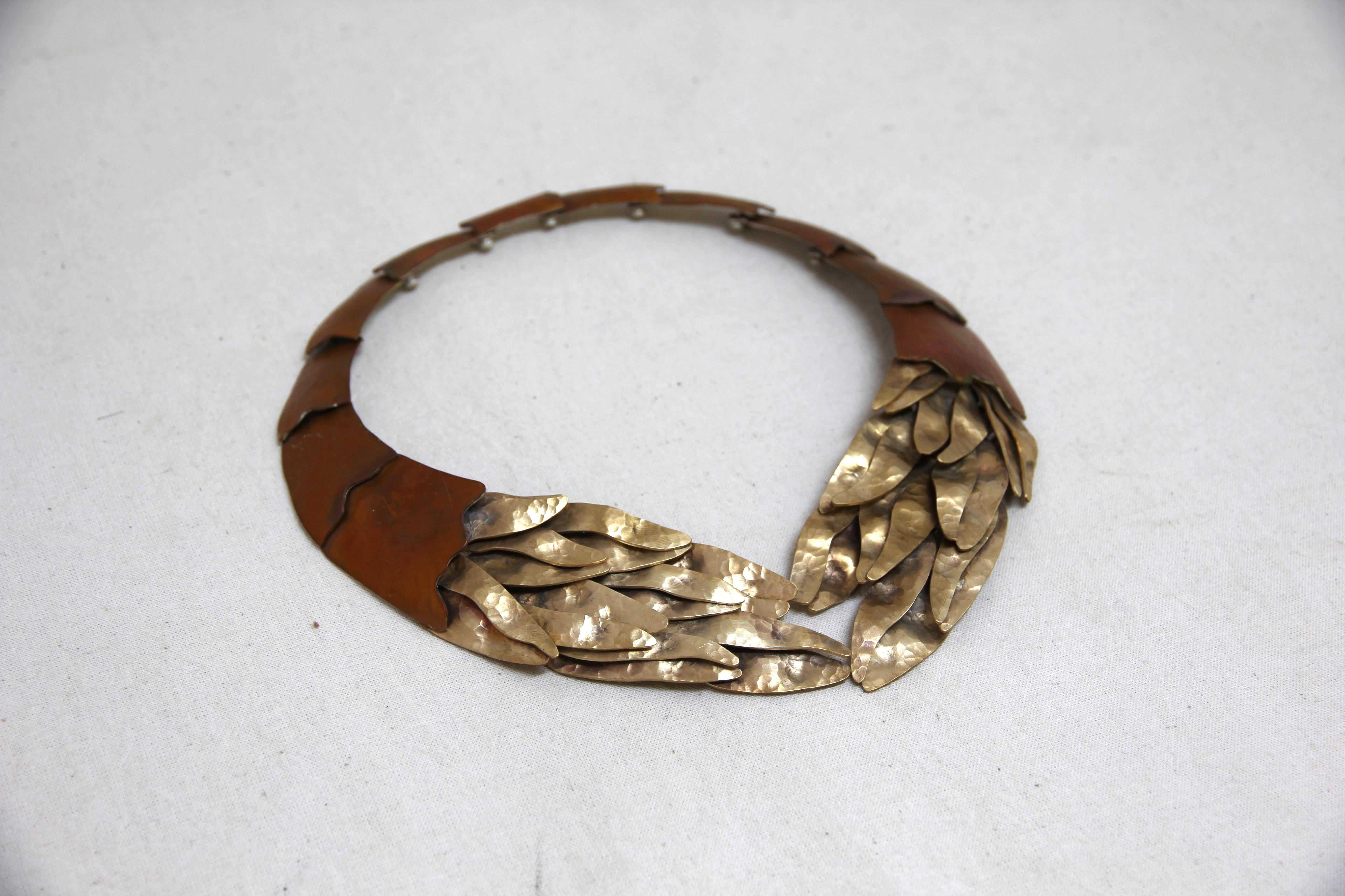 
Inspired by beautiful forms of marine life, this abstract piece designed by Eduardo Herrera and crafted in heat treated copper underlined with silver .950 and tumbaga.

Using ancestral techniques passed on by generations Eduardo Herrera