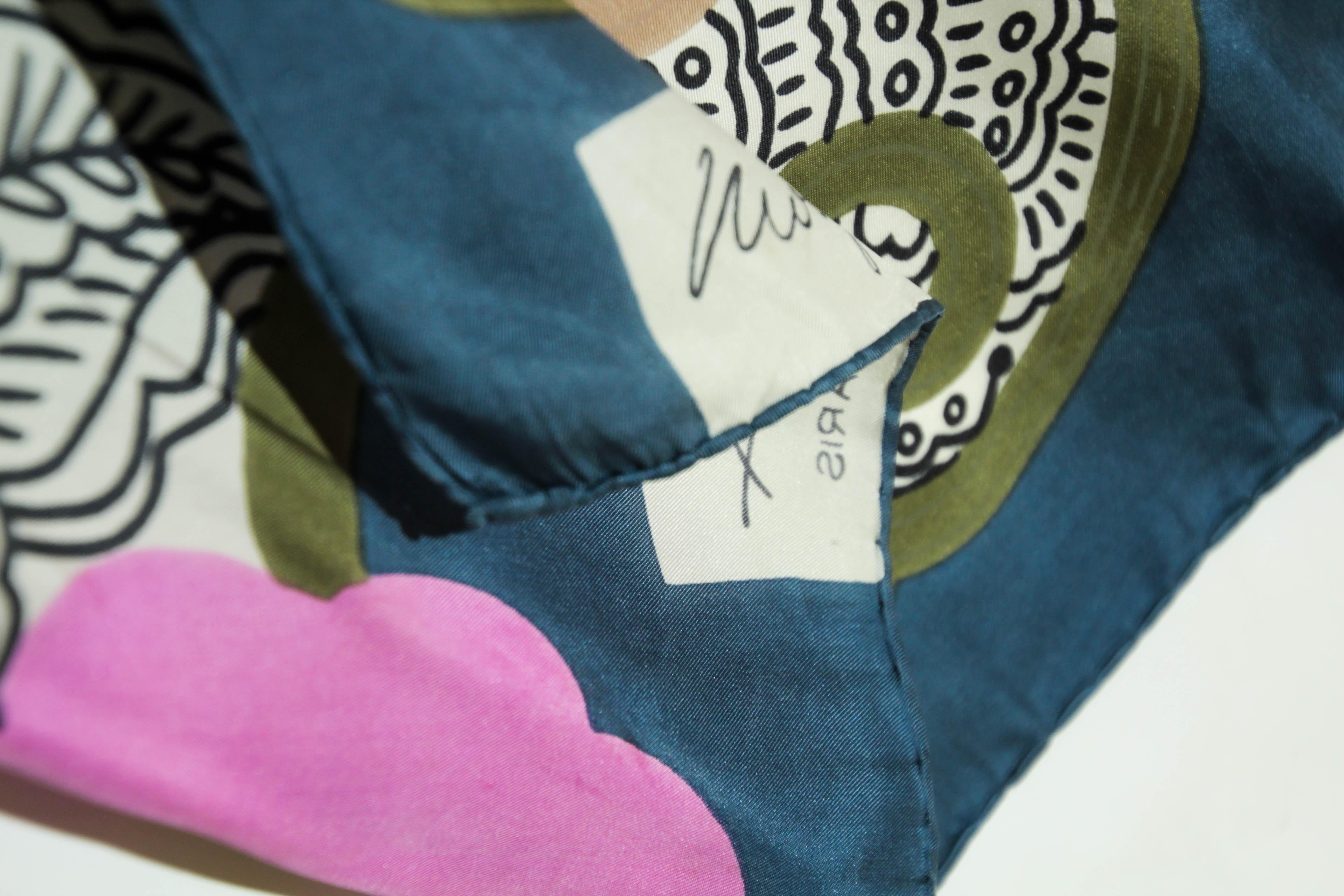Edward Molyneux Paris Silk Scarf circa 1980s.
Vintage Molyneux silk scarf with floral motifs Molyneux Paris pink blue, brown and green colors.
Dimensions: 28x 29.5 inches.
Made in France, 100 % silk with hand rolled edges.
Condition: some light