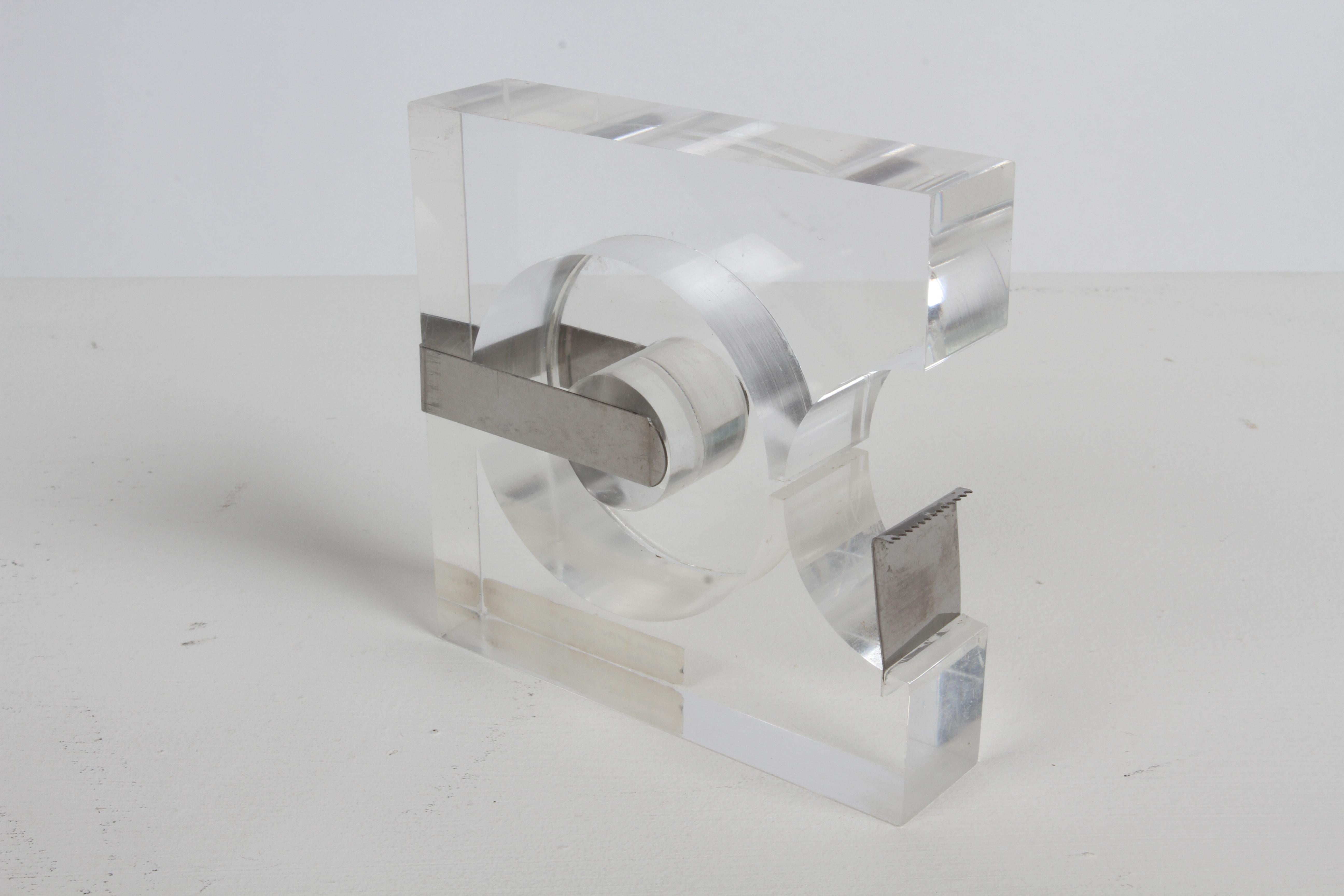 Vintage Robert P. Gottlieb Lucite / Steel Tape Dispenser in production from 1963-73. Two's Company, Mount Vernon, NY.. In the permanent Collection of MOMA New York. In fine working condition, with minor scuffs to Lucite. Label with MOMA collection