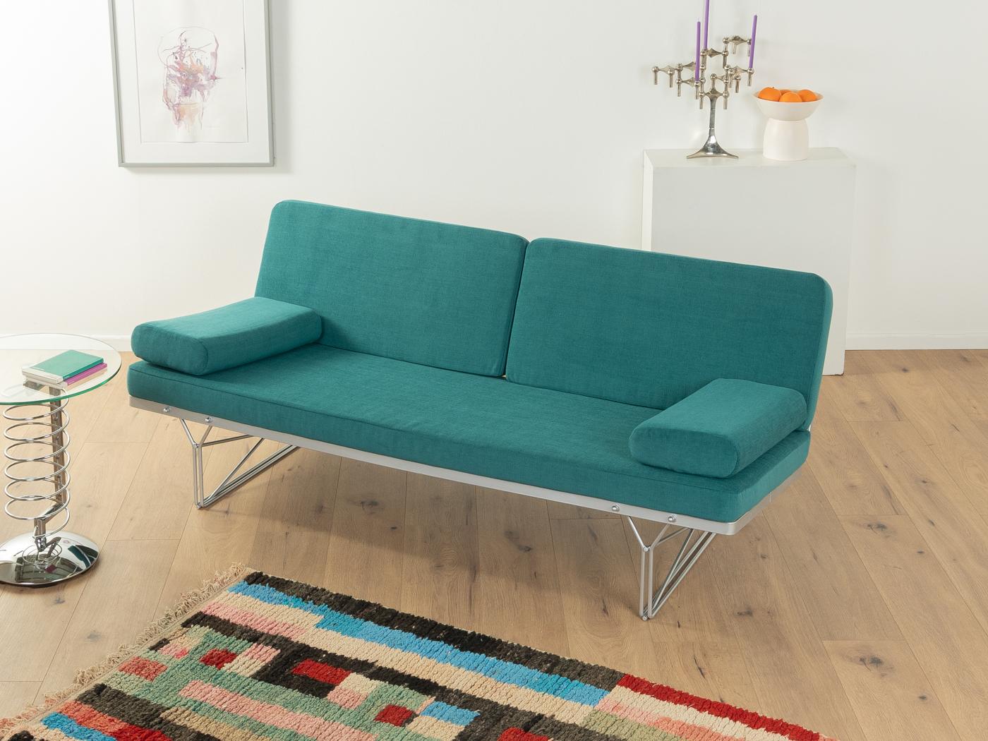Filigree Moment Sofa by Niels Gammelgaard for Ikea from the 1980s with a galvanised steel frame. The sofa has been reupholstered and covered with a high-quality fabric in teal.

Quality Features:
    very good workmanship
    high-quality materials
