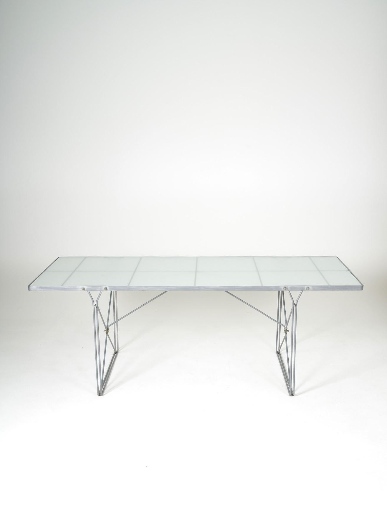 Vintage dining table by Niels Gammelgaard for Ikea, produced in the 80s. Grey steel frame and glass top. Very good condition with some traces of use on the base.