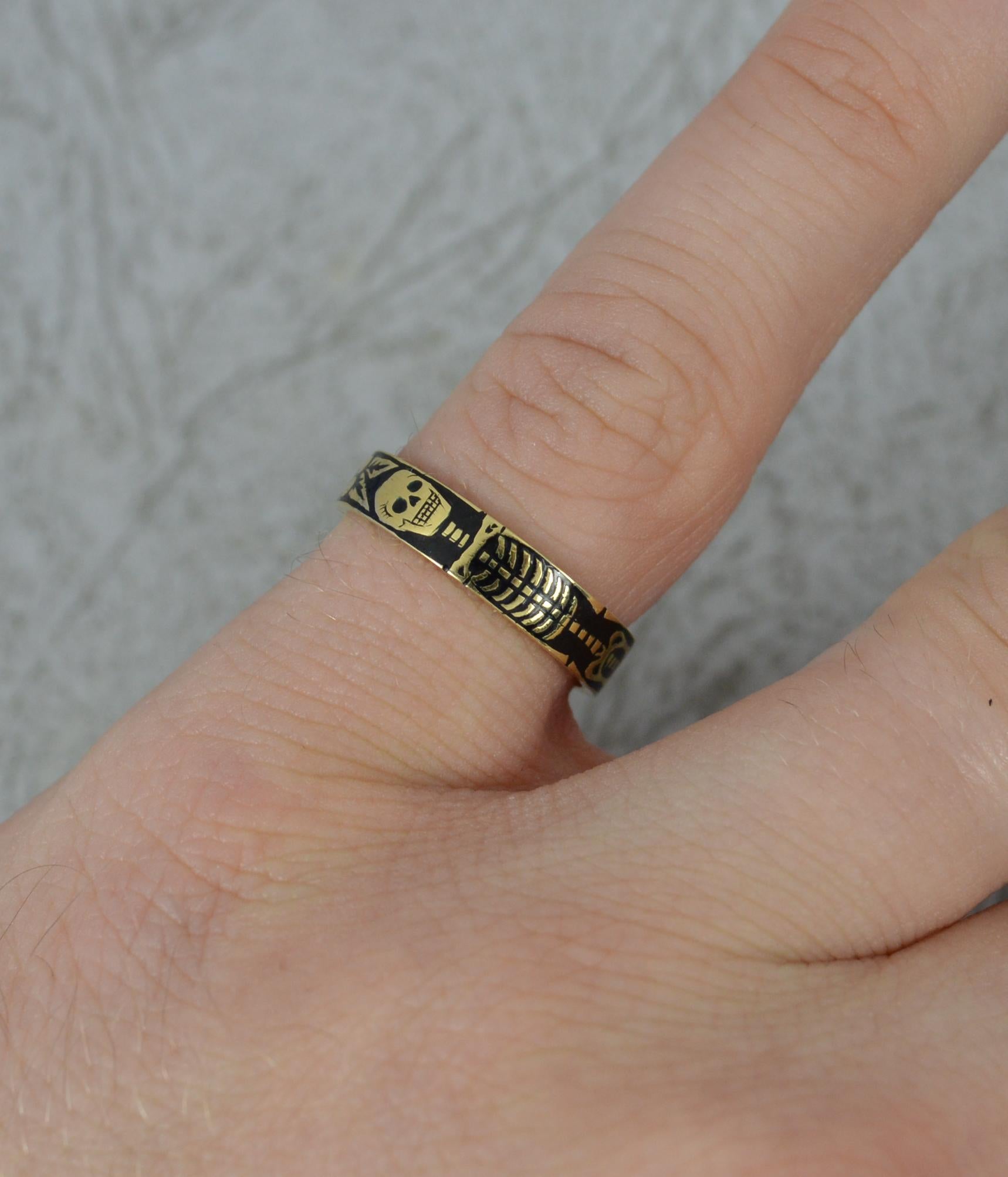 A stunning example of a Georgian style Momento Mori mourning ring.
Solid 18 carat gold and black coloured enamel example.
Incredibly well made. Hand made enamelling in a kiln as the original momento mori bands were.
The piece depicts a large full