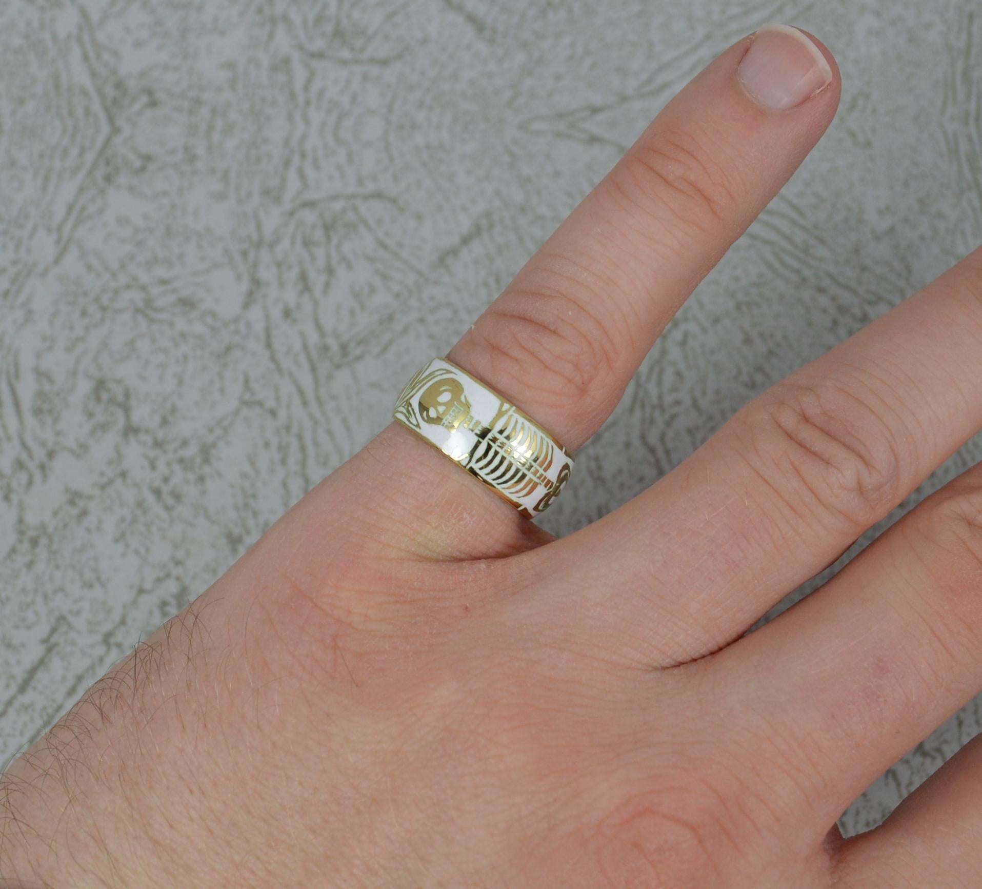 A stunning example of a Georgian style Momento Mori mourning ring.
Solid 18 carat yellow gold and white enamel example.
Incredibly well made. Hand made enamelling in a kiln.
The piece depicts a large full body skull and bones example and single