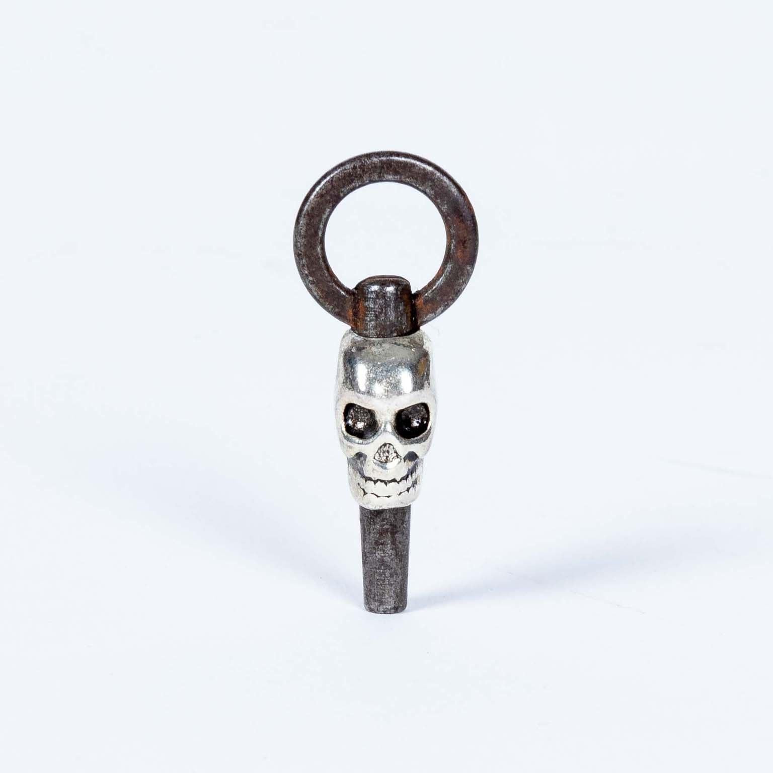 Memento Mori skull pocket watch winding key fob in vintage condition.  This is a Verge pocket watch key.  
