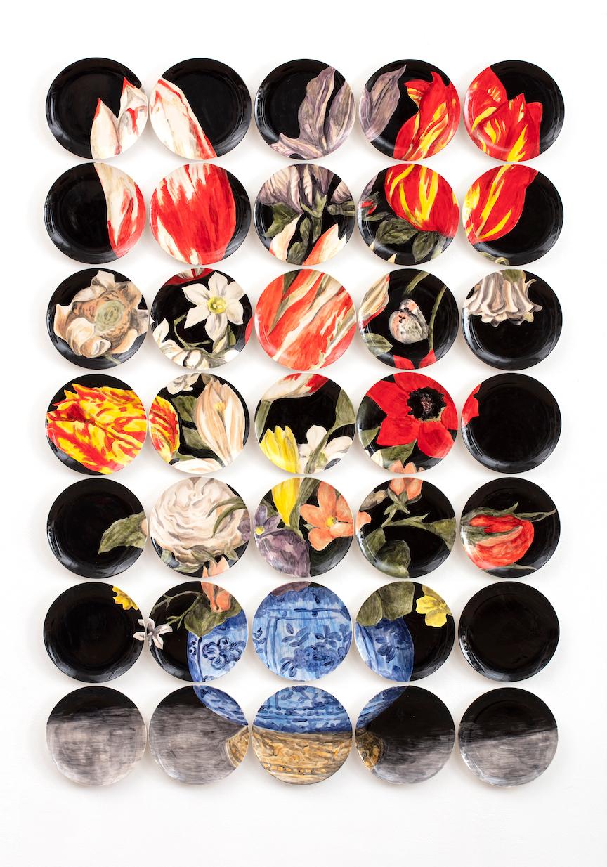Using ceramic surfaces as her canvas Hatch extends her historically-inspired contemporary repertoire with Memento, a wall installation comprised of 35 hands painted plates. The central image of the work, a large vase of vibrantly painted flowers is