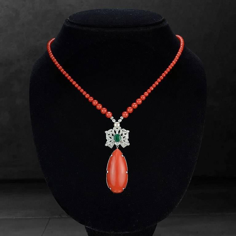 Momo Coral Drop 41.50 Carat with All Beads Necklace weight 44.93 Carat, set on 18K White Gold Pendant.  Center Emerald from Colombia 1.15 Carat surrounding by Brilliant Cut Diamond total 77 pcs. 0.64 Carat.  And also a Fresh Water Pearl on top of