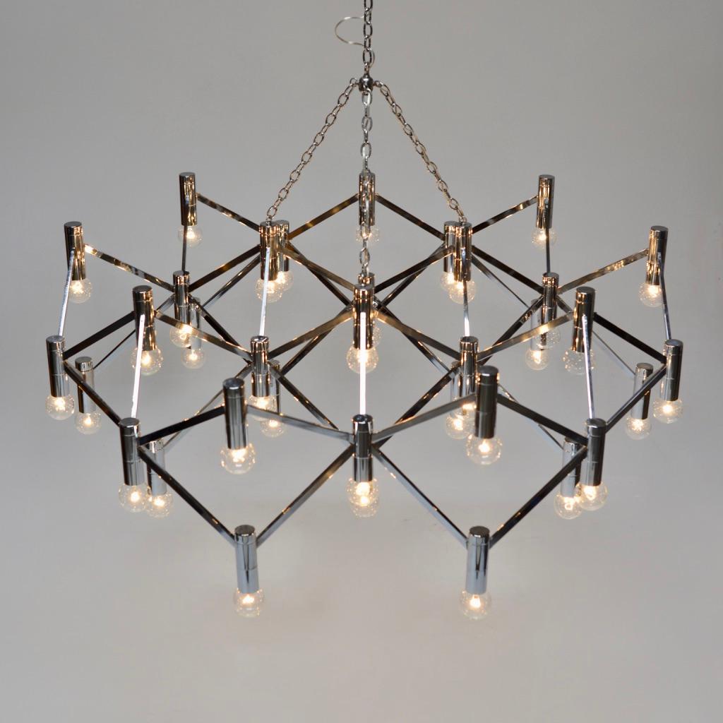 Very large geometric Italian modern chrome metal chandelier featuring a hanging metal chain and over 30 lights.
Wonderful condition, two available.