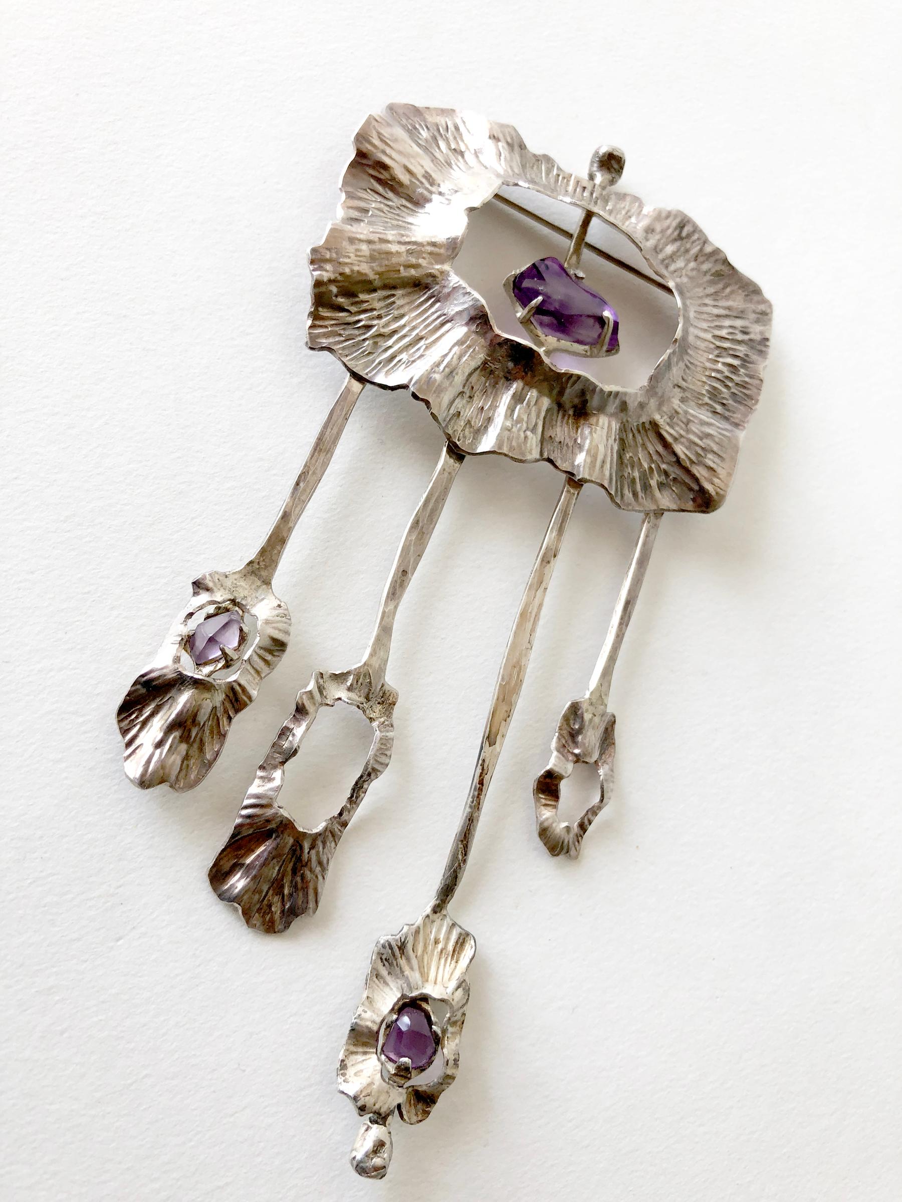 1970's California studio sterling silver and hand faceted amethyst kinetic brooch created by artist Mona Trunkfield of San Diego, California.  Brooch measures 4