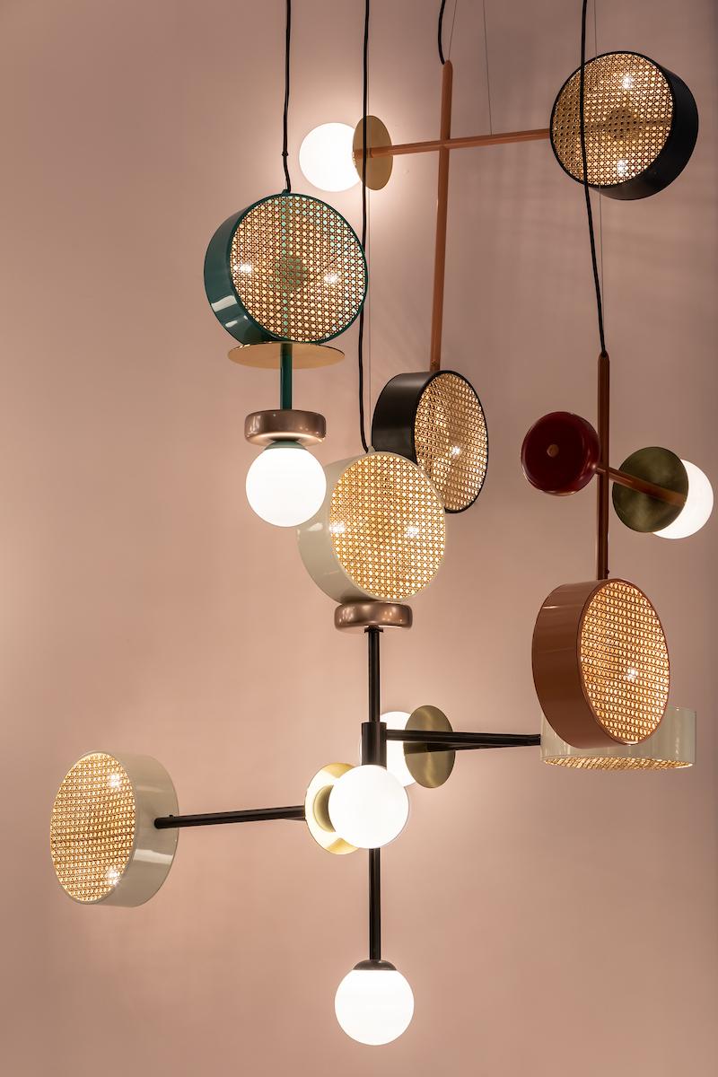 A perfect suspension of round shapes, rattan mesh and brass details intertwined with delicate and opaque glass globes. Made to Order. 

For sales with delivery address within European territories, VAT will be charged additionally to the stated