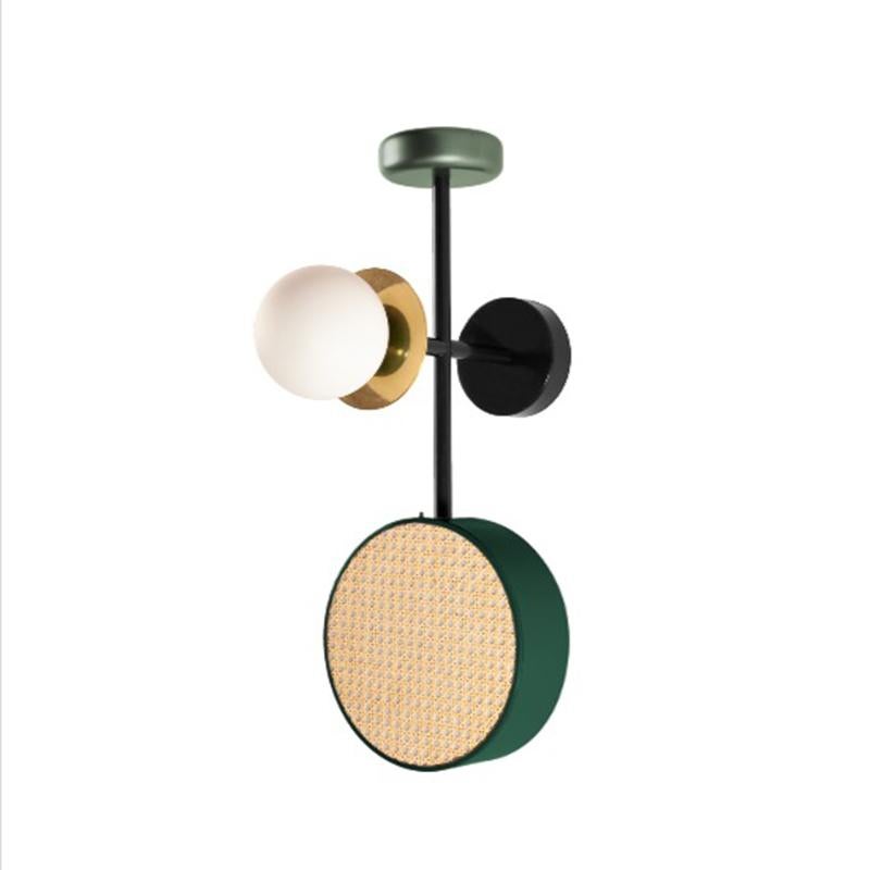 Monaco Wall is a perfect balance of round shapes, rattan mesh, wooden detail and brass details intertwined with delicate and opal glass globes. 
The structure and the metallic cylinder are finished in a smooth, homogeneous powder coating layer. The