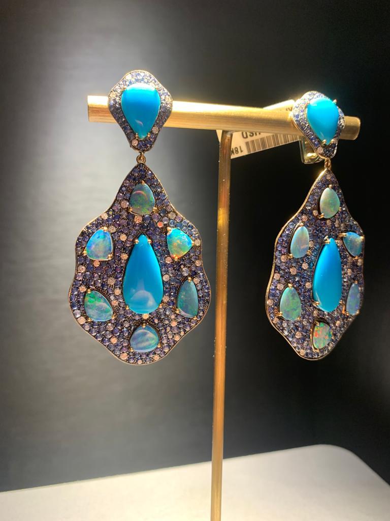 Monan earring with 1.14 carat round brilliant cut white diamonds, 12.48 carat turquoise, 8.86 carat opal and 10.25 carat sapphires on 18K gold. 