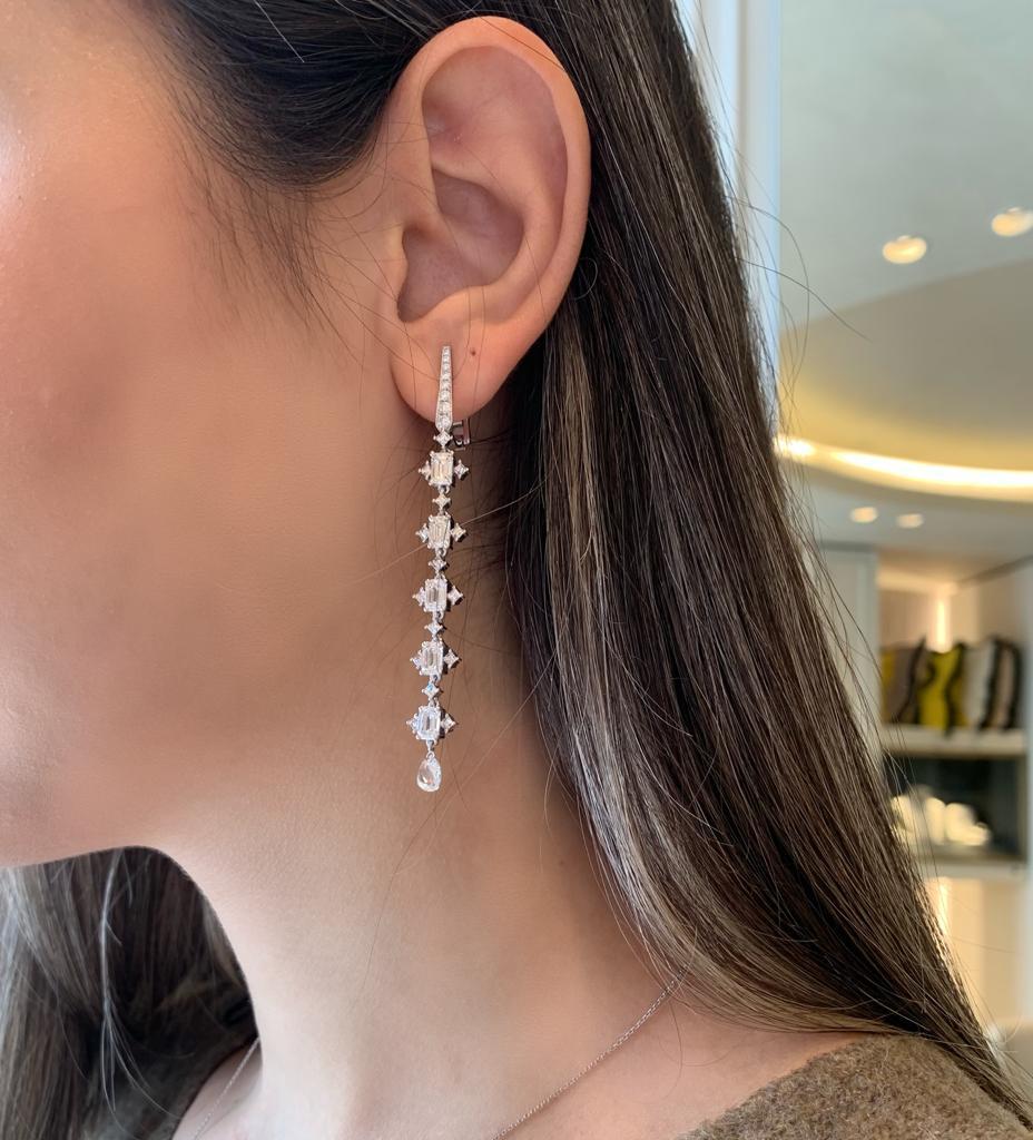 Limited Edition Monan Drop Earrings created by using 4.01 carats emerald cut, 1.29 carats briollette cut, 1.08 carats princess cut and 0.09 carats round brilliant cut diamonds, for a total of 6.47 carats.