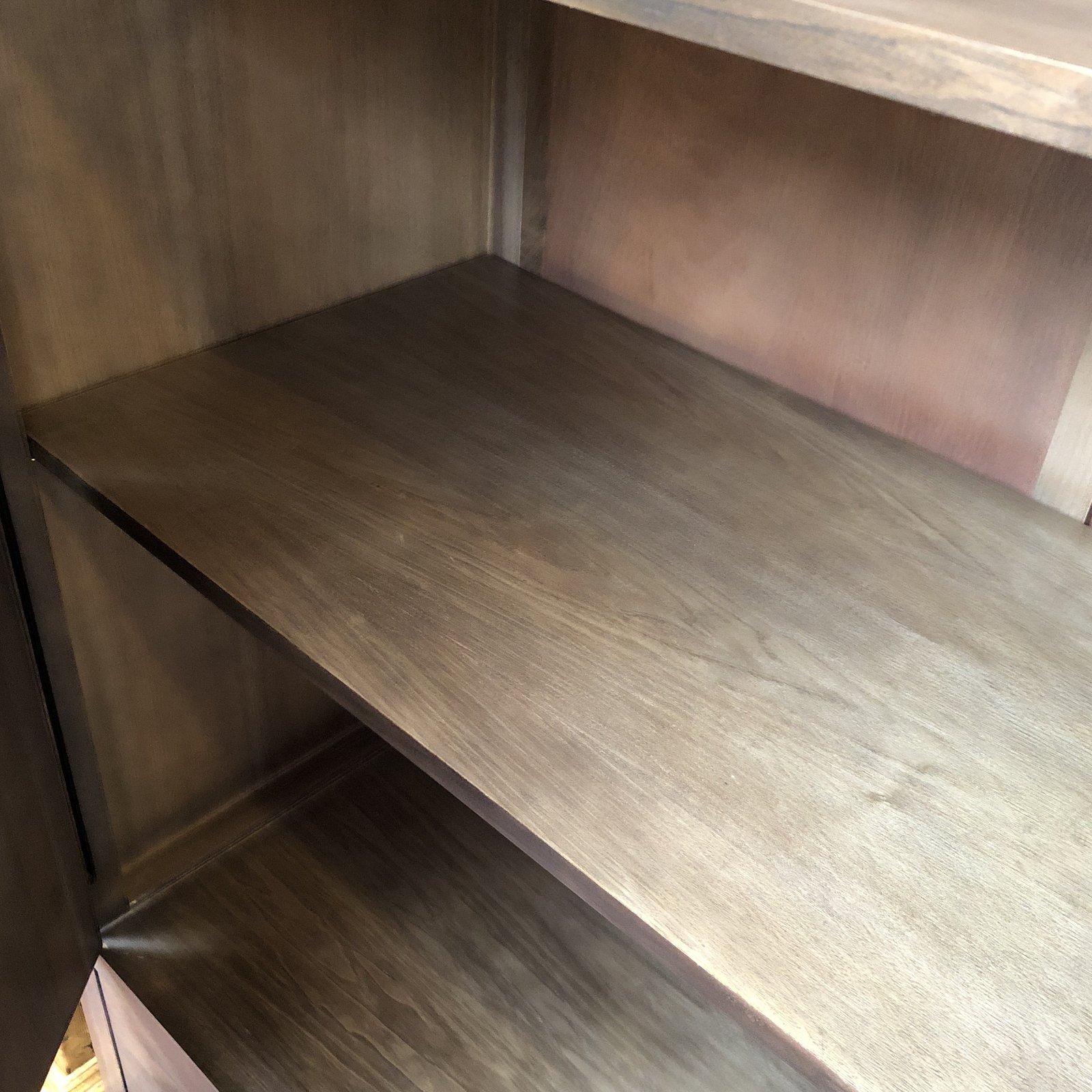 The monarch cabinet by Crate & Barrel. Designed by Maria Yee, is crafted of solid walnut using traditional Chinese joinery. This Shitake finished cabinet provides ample storage with large adjustable shelves and a pair of deep drawers. Modern with