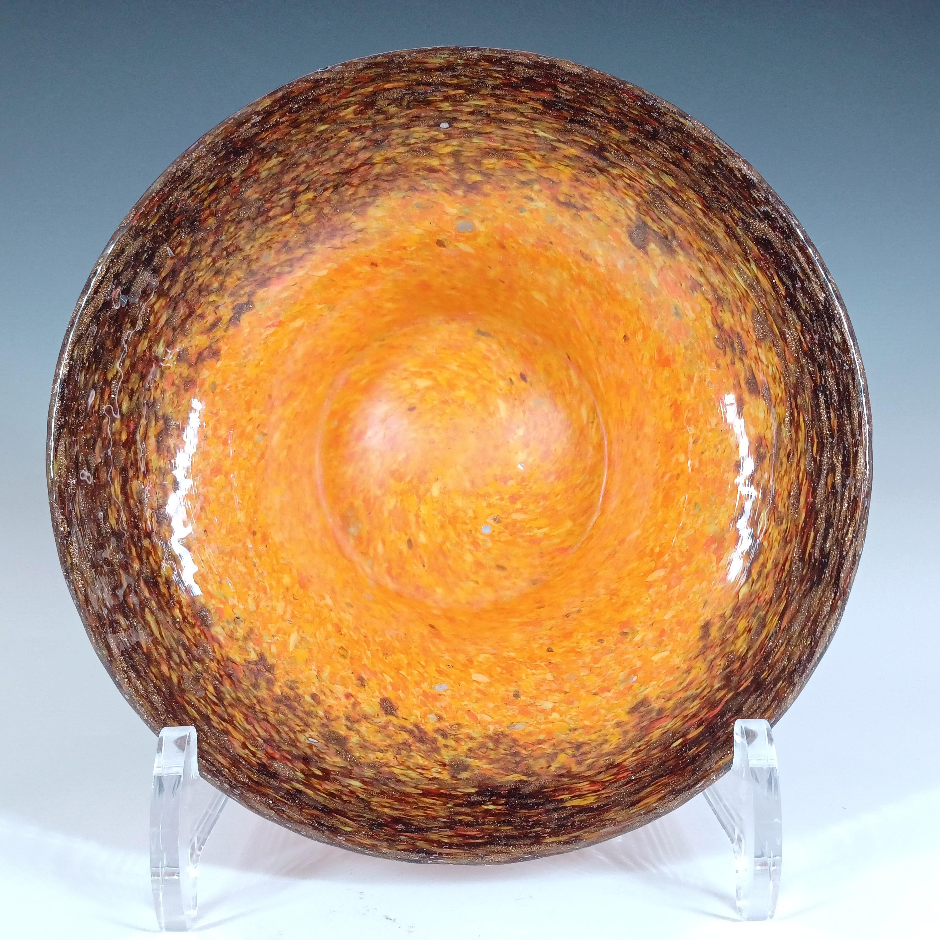 A Monart orange and black mottled glass ashtray bowl with speckles of copper aventurine. Made by the Scottish Moncrieff's factory in the 1930's/40's, shape number UB. Unmarked but has the classic Monart base finish (raised pontil and flat outer