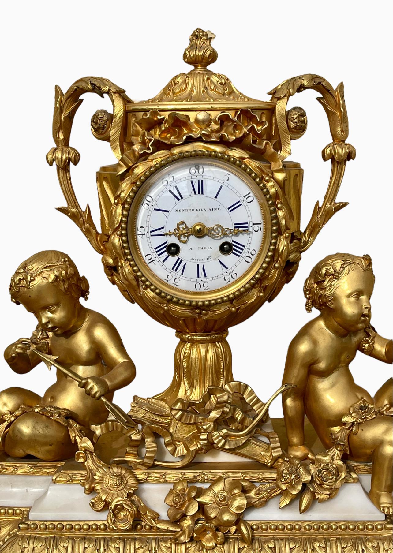 Superb clock in white marble and chiseled gilt bronze signed on the enamel dial 
