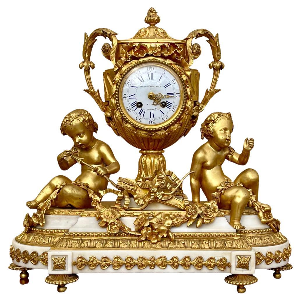 MONBRO Aîné Son & JACQUIER - Bronze and Marble Clock with Puttis, XIXth century