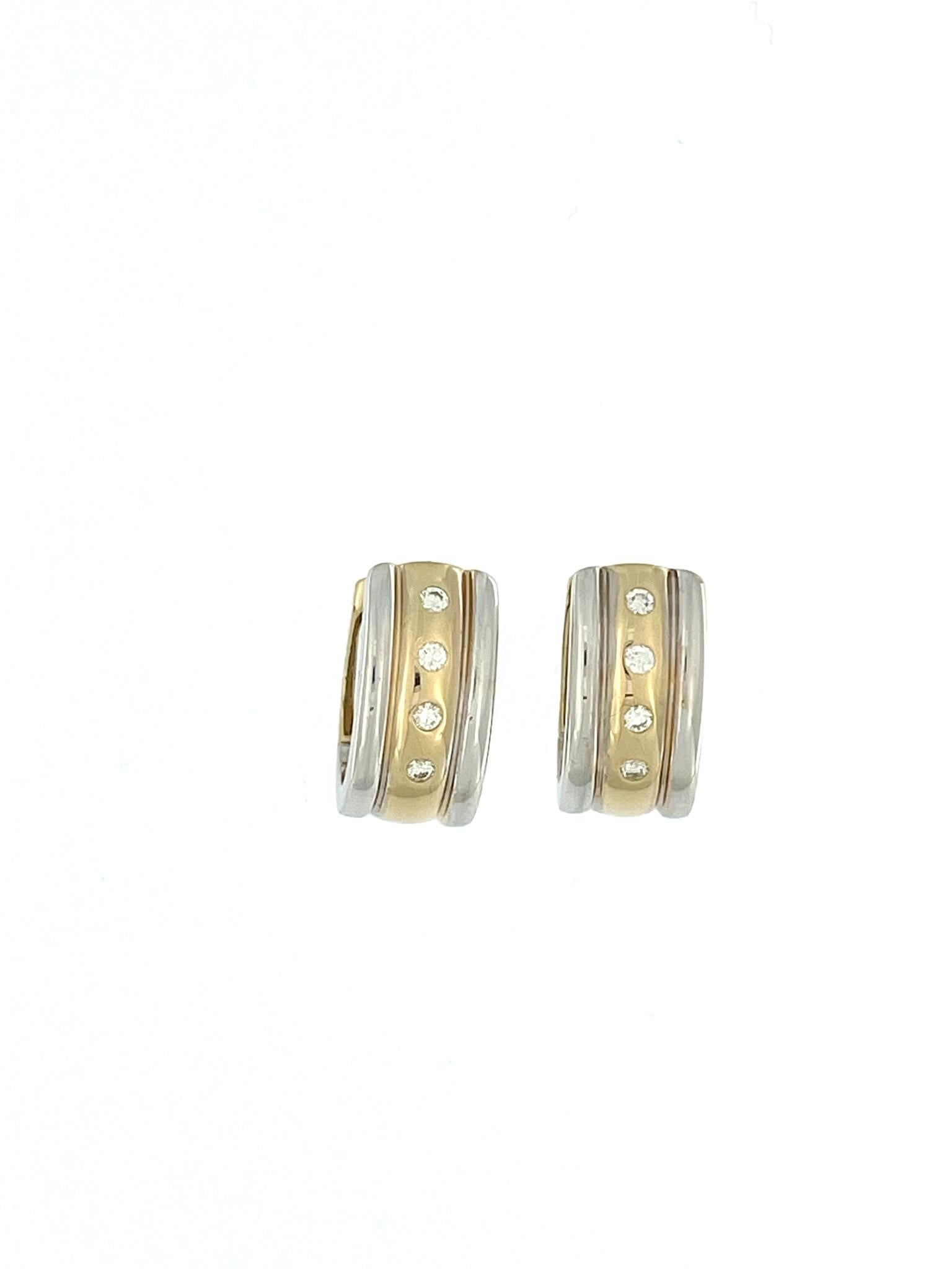 Les Eleg en or 14 carats avec diamants de Moncara sont un accessoire luxueux et sophistiqué qui allie harmonieusement élégance et savoir-faire. Ces boucles d'oreilles exquises sont fabriquées en or 14 carats de haute qualité, présentant un beau
