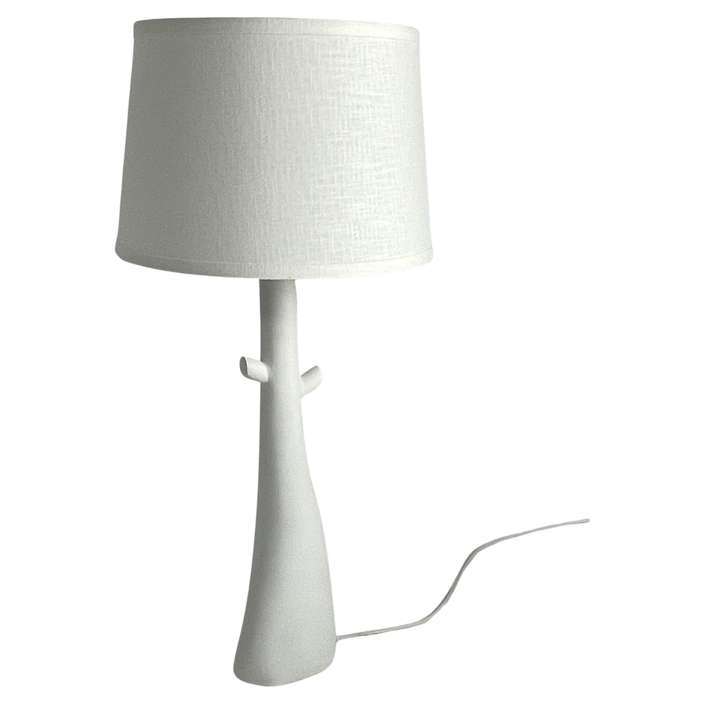 Plaster of Paris handcrafted table lamp with a tree shaped design. Linen shade and nickel-plated hardware. Light uses on medium based three-way bulb. Shade size is 10