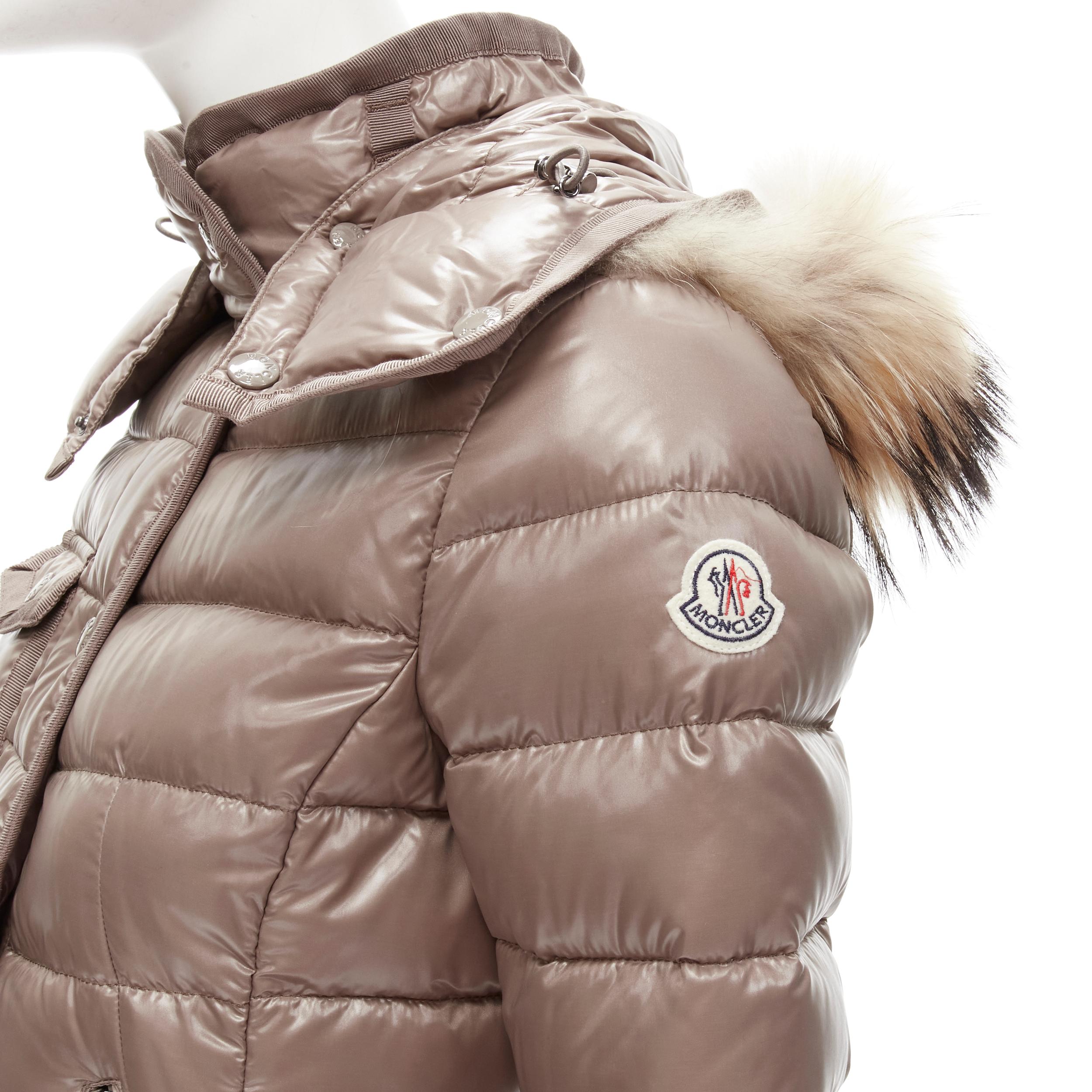 MONCLER Armoise Giubbotto brown fur hood down feather puffer jacket US0 XS 
Reference: ANWU/A00471 
Brand: Moncler 
Material: Nylon 
Color: Brown 
Pattern: Solid 
Closure: Zip 
Extra Detail: Dual zip pockets. Snap button zip front closure. Removable