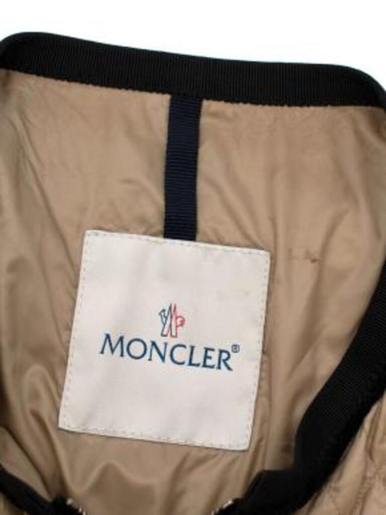Moncler beige & black nylon Roseline jacket
 

 - Made of luscious polyamide. 
 - Perfect fitting jacket.
 - 4 pockets including 2 breast pockets. 
 - Black trim around a beige background. 
 

 Made in Bulgaria. 
 Hand wash.
 Condition 9.5/10.
 

