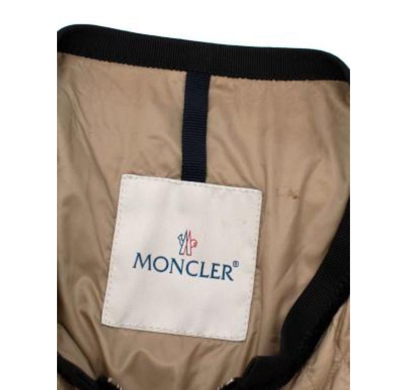 Moncler beige & black nylon Roseline jacket

- Made of luscious polyamide. 
- Perfect fitting jacket.
- 4 pockets including 2 breast pockets. 
- Black trim around a beige background. 

Made in Bulgaria. 
Hand wash.
Condition 9.5/10.

PLEASE NOTE,