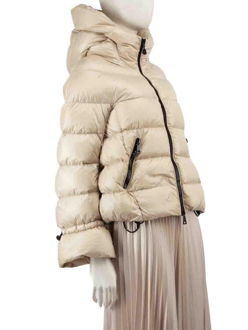 CONDITION is Very good. Minimal wear to coat is evident. Light tarnishing to the zip pullers and slight discolouration to the cuff edges, back neck and left side near hem on this used Moncler designer resale item.
 
 
 
 Details
 
 
 Beige
 
