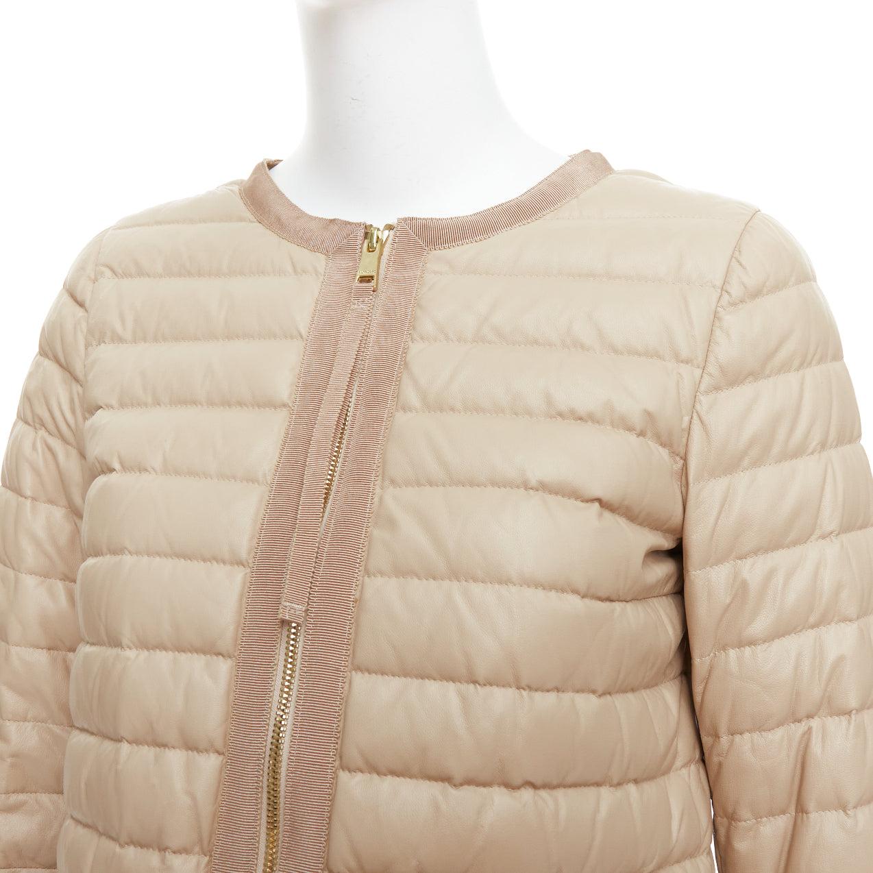 MONCLER beige lambskin leather goose down lightweight  padded puffer Sz1
Reference: NKLL/A00318
Brand: Moncler
Material: Leather
Color: Nude, Gold
Pattern: Solid
Closure: Zip
Lining: Nude Goose Down
Made in: Hungary

CONDITION:
Condition: Excellent,