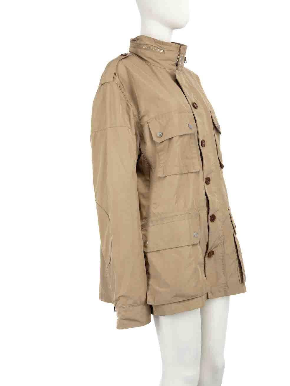 CONDITION is Good. General wear to jacket is evident. Moderate signs of wear to the front and back with discoloured marks. The front pocket buttons are also slightly tarnished and the neck zip at the back has tarnishing on this used Moncler designer