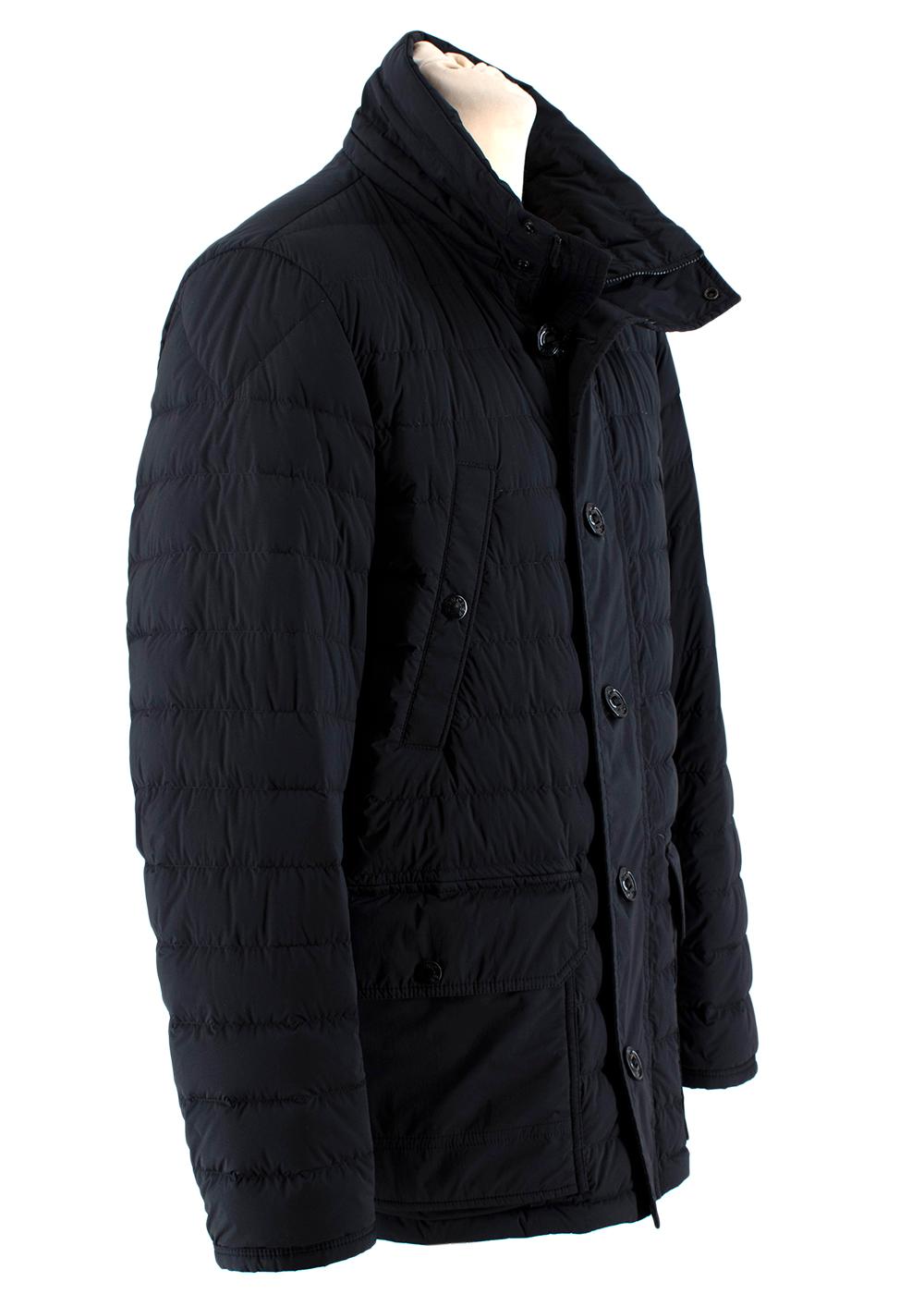 Moncler Black Dartmoor Quilted Down Coat
-Flap pockets with snap fastening
-Chest welt pockets with snap closures
-Front opening with zipper and branded buttons
-Leather black Moncler logo on left sleeve

Materials: 85% nylon
15% spandex
Lining: 90%