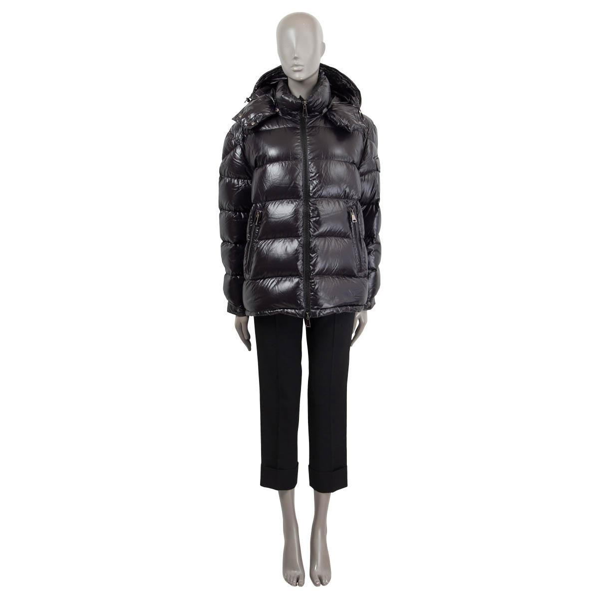 100% authentic Moncler 'Maire' quilted puffer jacket in black shiny nylon (100%). Features a stand collar, drawstring hood, flap pocket on the arm and two zip pockets on the front. Opens with a zipper on the front. Down filling. Has been worn and is