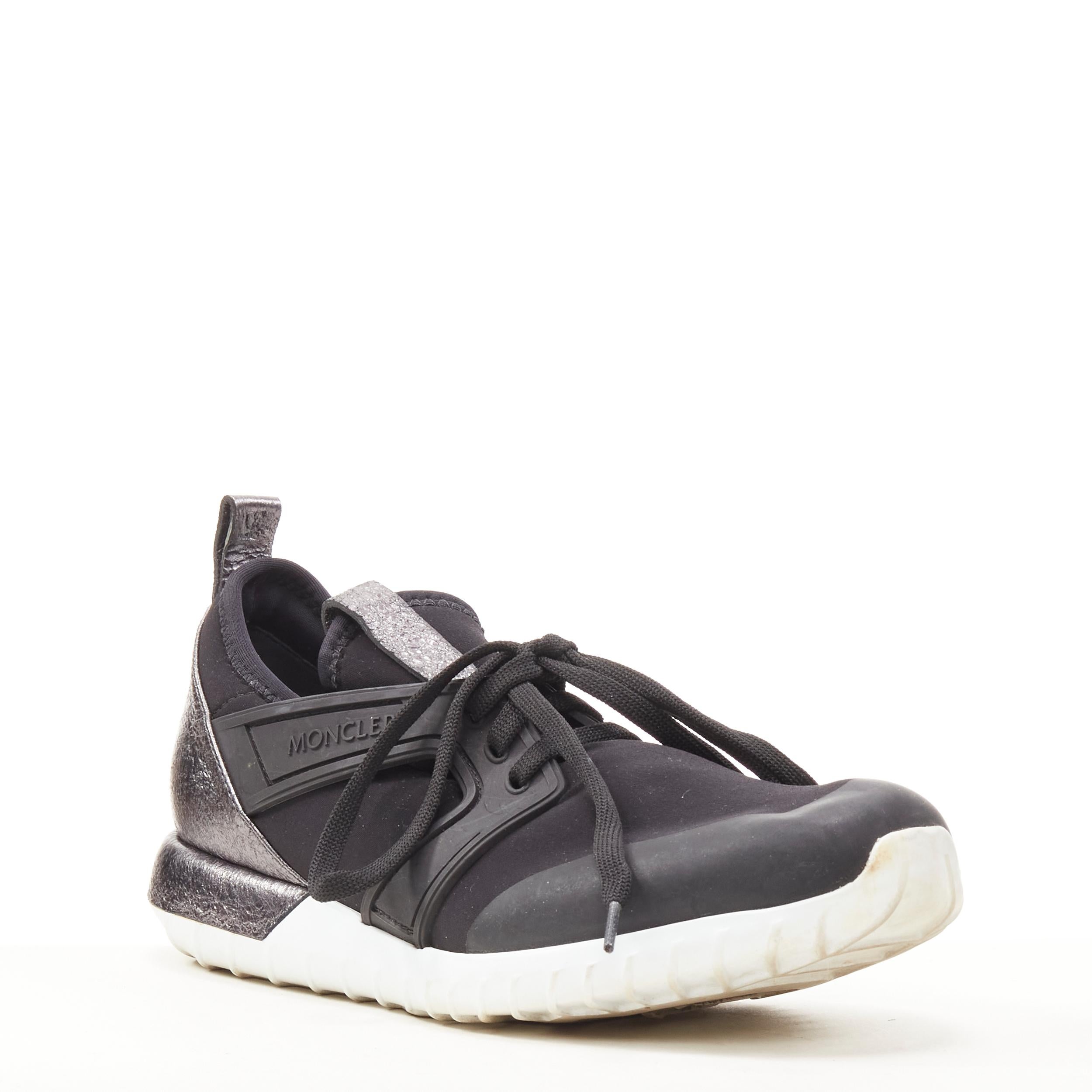 MONCLER black neoprene plastic caged metallic leather heel sports sneaker EU37 
Reference: SNKO/A00202 
Brand: Moncler 
Material: Neoprene 
Color: Black 
Pattern: Solid 
Closure: Lace 
Extra Detail: Neoprene upper. Moncler signed caged outer. Lace