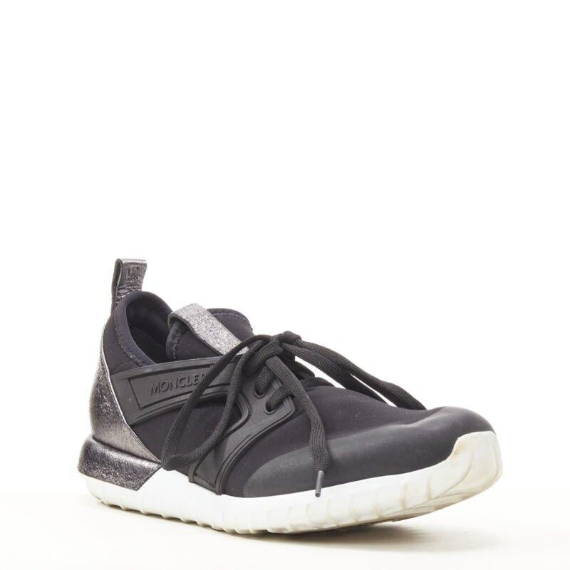 MONCLER black neoprene plastic caged metallic leather heel sports sneaker EU37
Reference: SNKO/A00202
Brand: Moncler
Material: Neoprene, Rubber
Color: Black, Silver
Pattern: Solid
Closure: Lace Up
Extra Details: Neoprene upper. Moncler signed caged