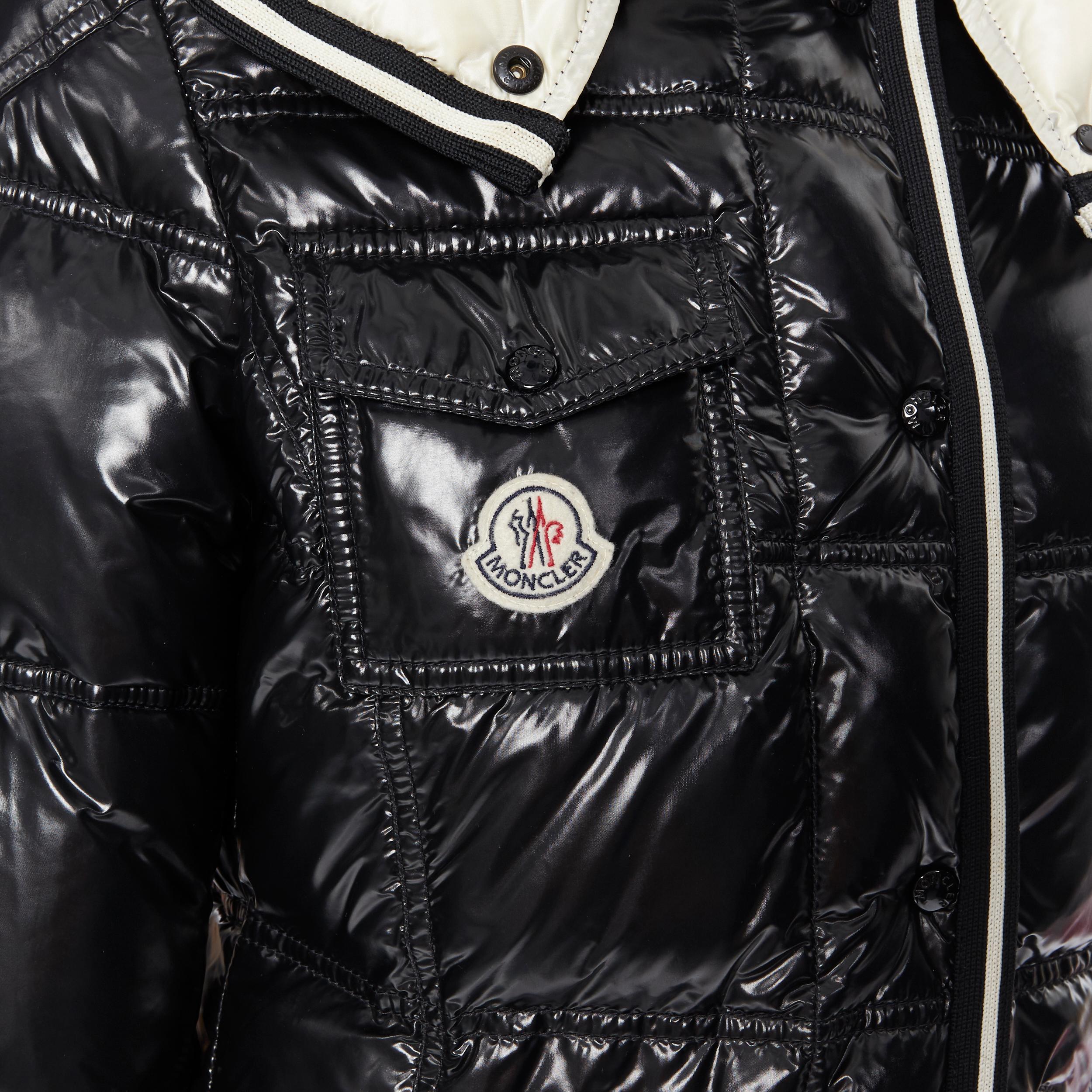 MONCLER black nylon down feather removable hood puffer jacket US0 XS
Brand: Moncler
Model Name / Style: Puffer jacket
Material: Nylon, down
Color: Black, cream
Pattern: Solid
Closure: Button
Extra Detail: Shiney outer. Moncler logo at breast pocket.