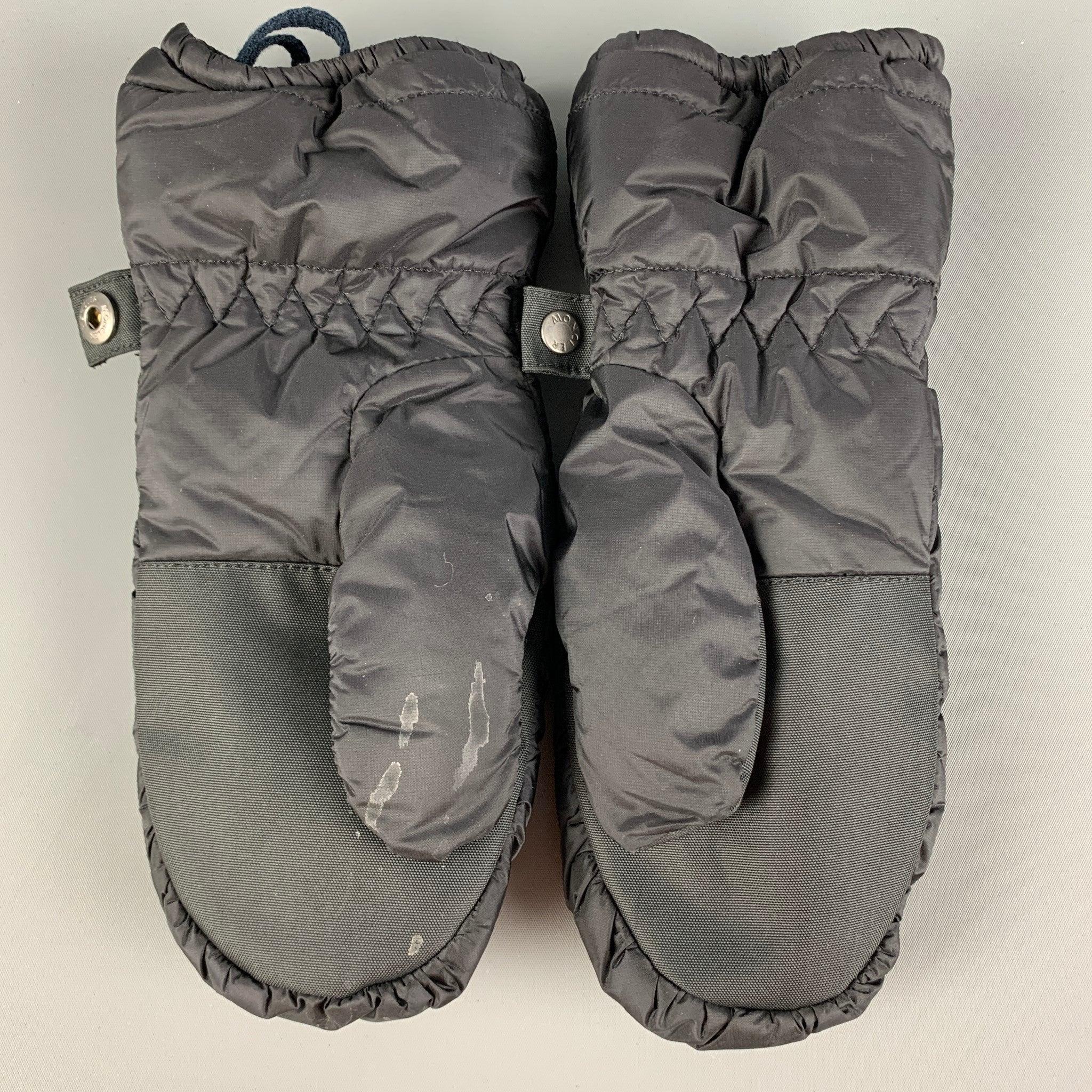 MONCLER mittens comes in a black nylon with a polyester lining and a elastic hem. Includes tags.
Good
Pre-Owned Condition. Moderate discoloration. As-is.  

Marked:  
L  

Measurements: 
  Height: 9.8 inches Length: 4.25 inches 
  
  
 
Reference: