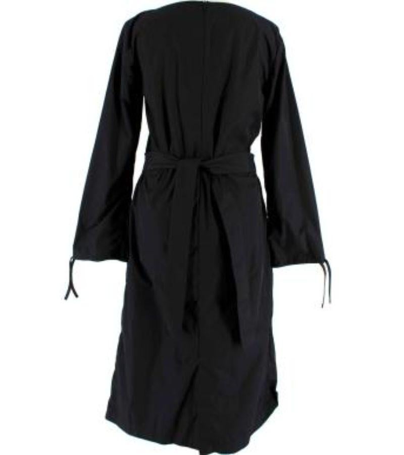 Moncler x JW Anderson Black Ruched Cotton Blend Dress with Belt

- Long sleeved midi dress with ruching and slight cowl neck
- Cotton polyester blend medium weight unlined fabric 
- Drawstring sleeve cuffs 
- Tie belt at the back 
- Zip down the